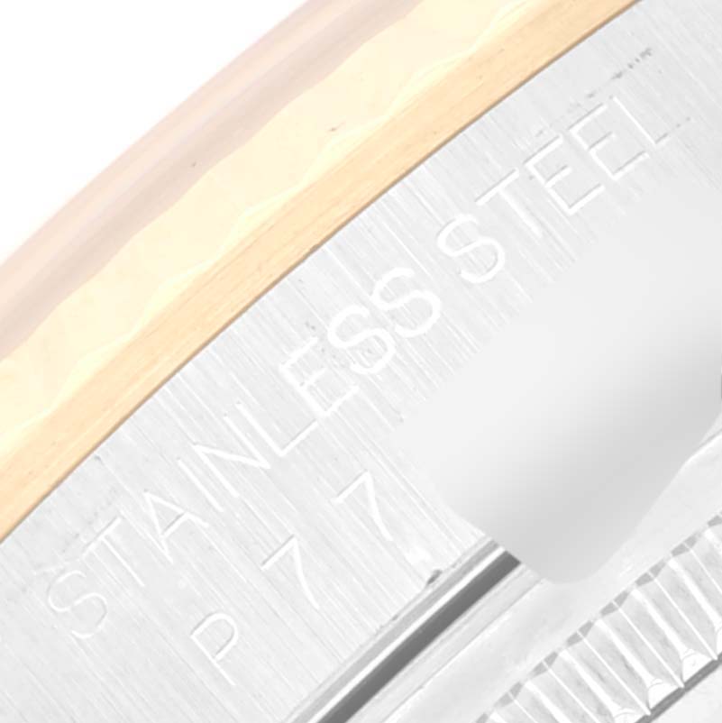 This image shows a close-up of the bezel and part of the casing of a Rolex Datejust 16233 Men's Steel and Gold (two tone) Silver Dial 16233 Men's Steel and Gold (two tone) Silver Dial watch, highlighting "STAINLESS STEEL."