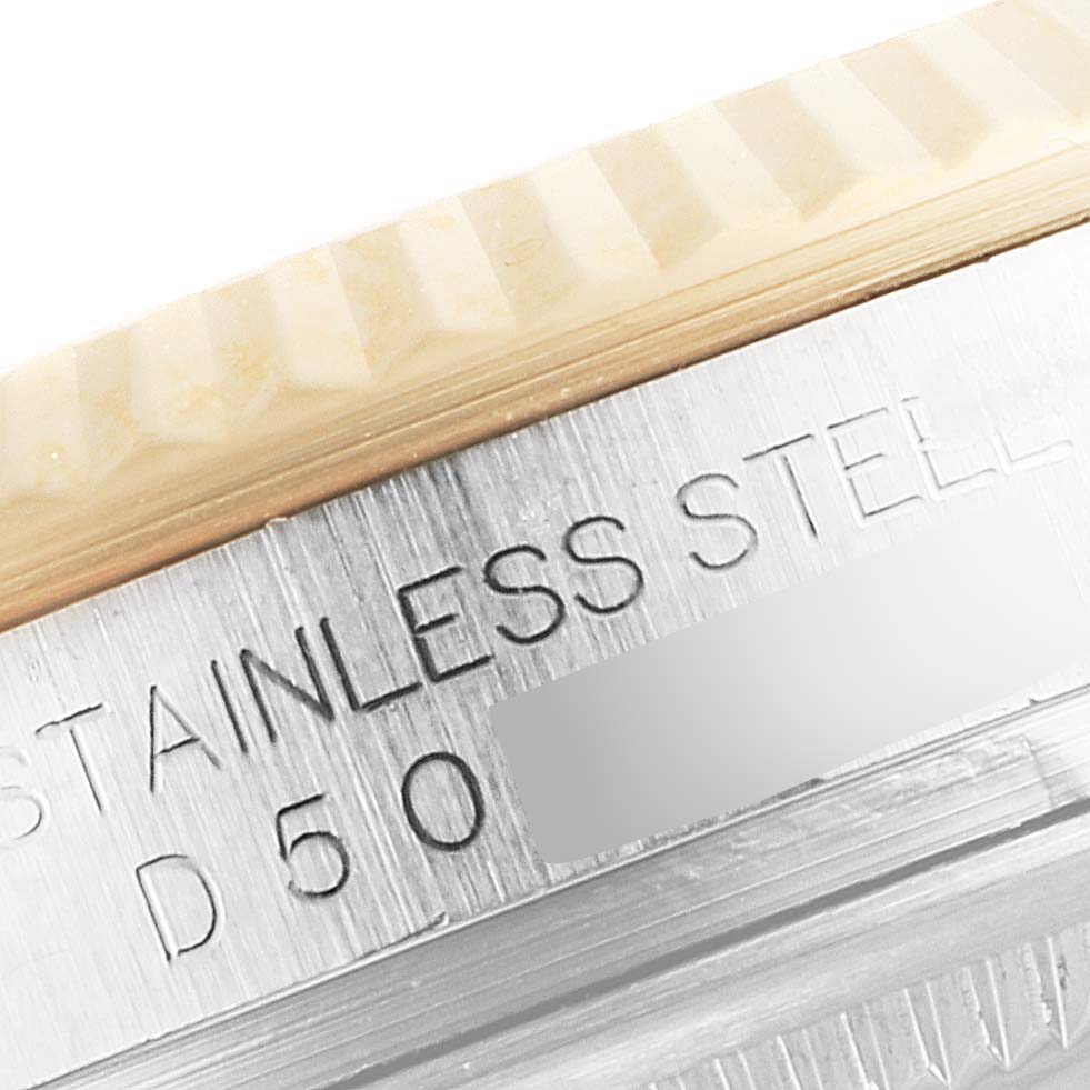 The image shows a close-up angle of the stainless steel casing and fluted bezel of a Rolex Datejust 116233 Men's Steel and Gold (two tone) Grey Dial 116233 Men's Steel and Gold (two tone) Grey Dial watch.