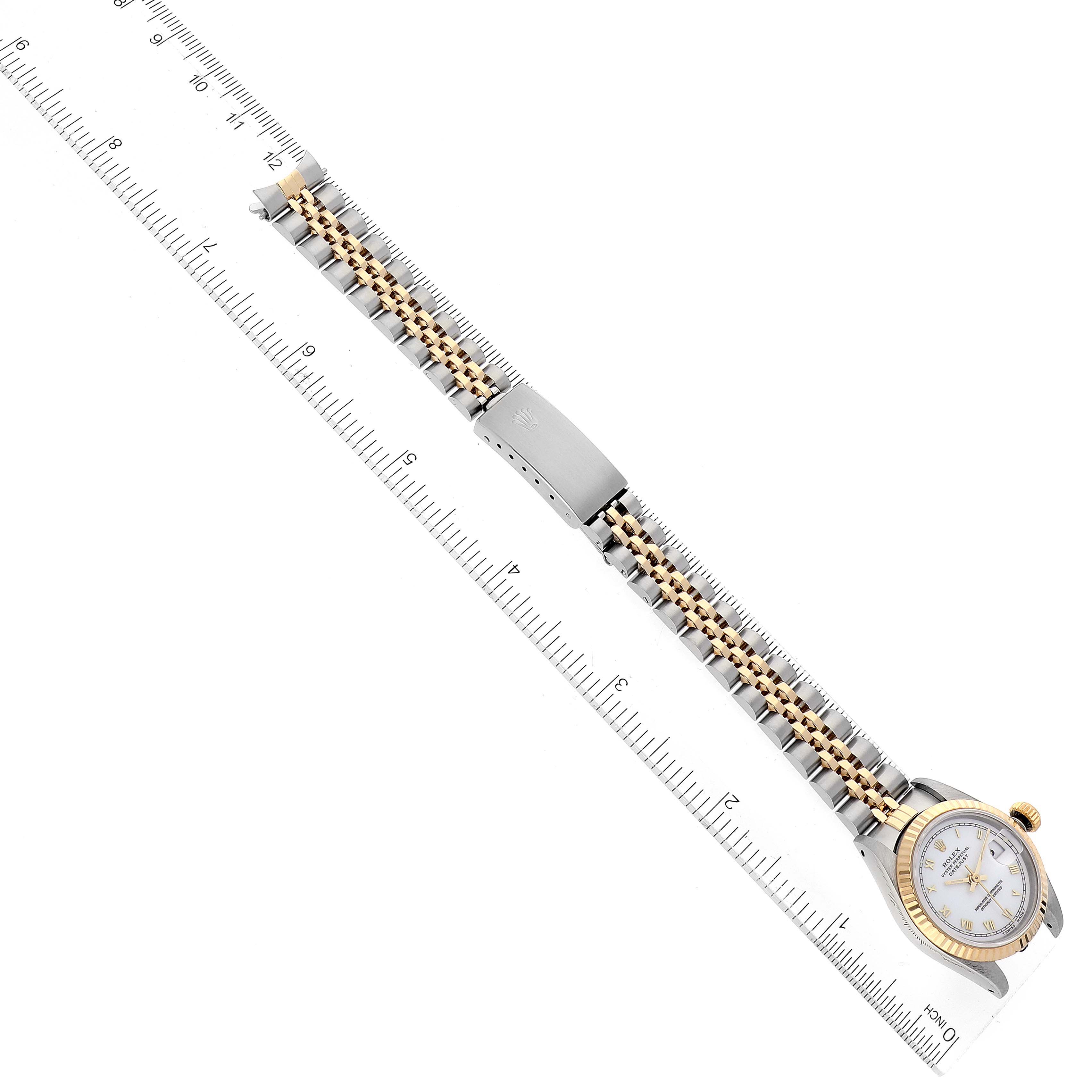 The image shows a Rolex Datejust 69173 Women's Steel and Gold (two tone) White Dial 69173 Women's Steel and Gold (two tone) White Dial watch in a straight view, featuring the face, bezel, and full bracelet with a ruler for scale.