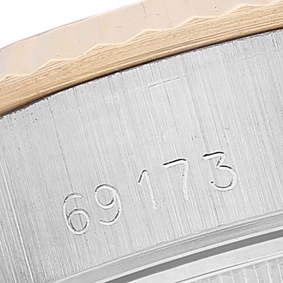 This close-up image shows the engraved model number "69173" on the side of a Rolex Datejust 69173 Women's Steel and Gold (two tone) White Dial 69173 Women's Steel and Gold (two tone) White Dial watch case.