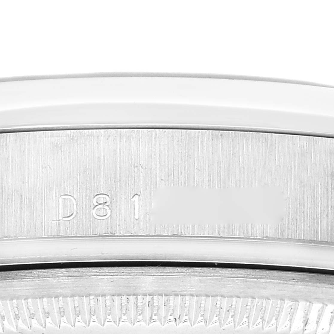 The image shows a close-up of the serial number engraving on the side of the Rolex President 118206 Men
s Platinum Blue Dial 118206 Men
s Platinum Blue Dial model watch.