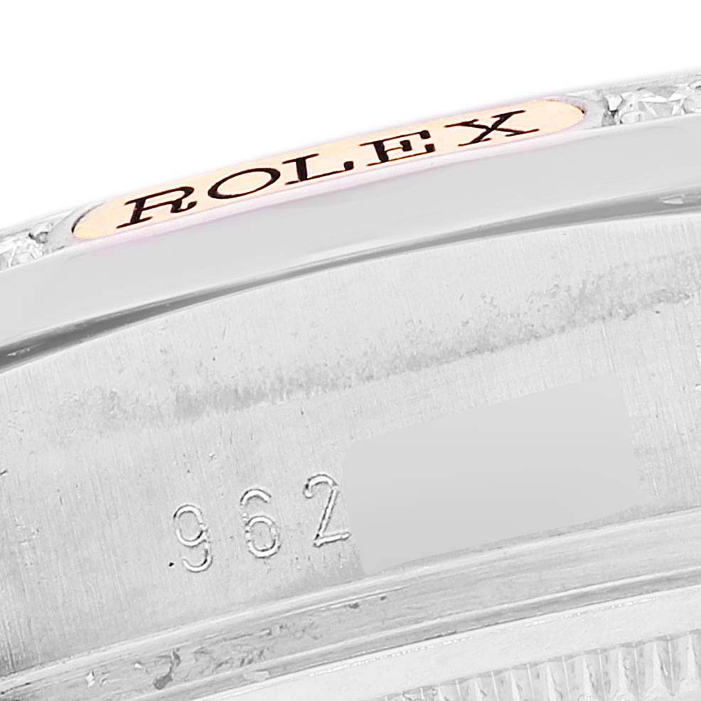 This close-up image shows the serial number and a portion of the bezel on a Rolex President 18139 Men's Steel and Gold (two tone) Brown Dial 18139 Men's Steel and Gold (two tone) Brown Dial model watch.