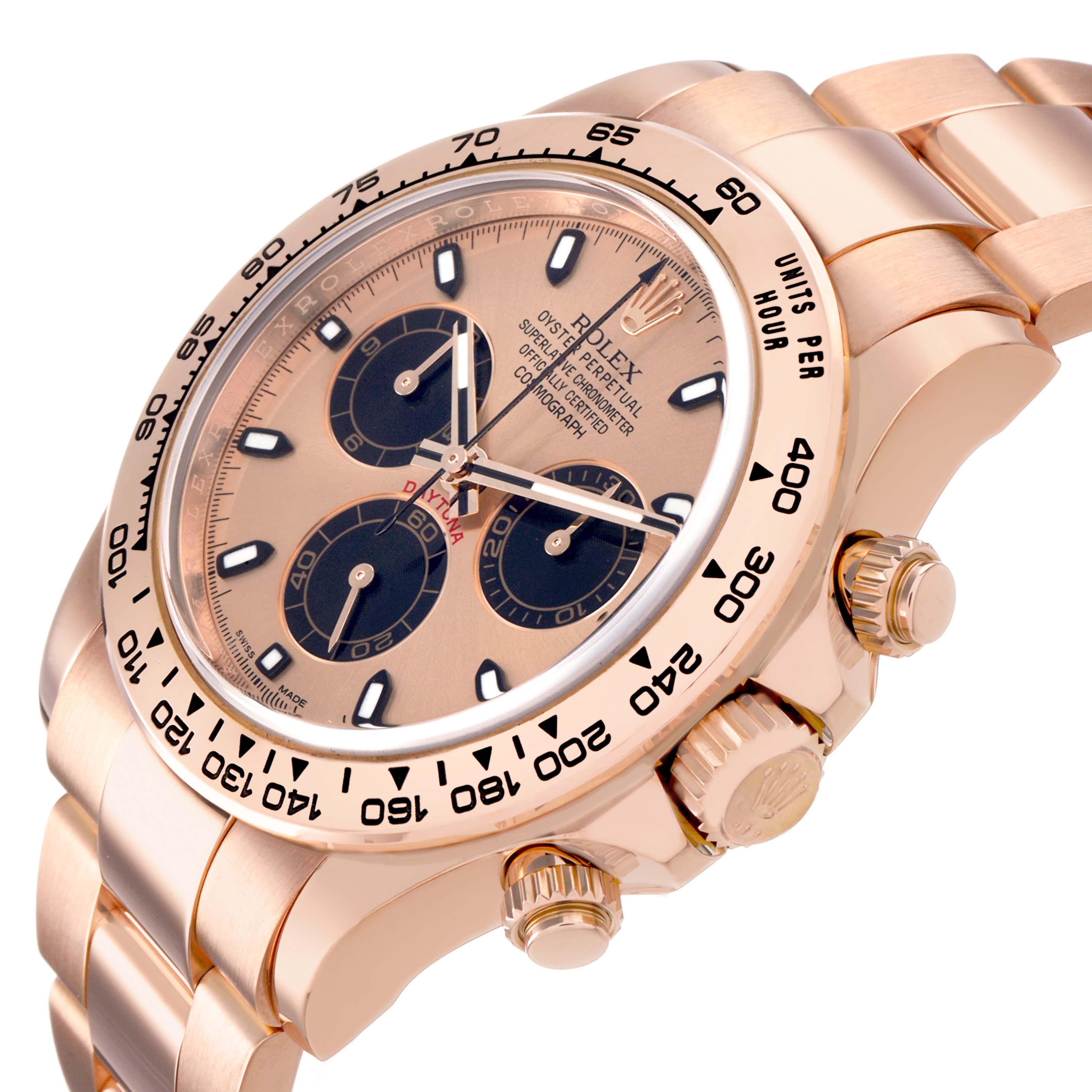 The Rolex Daytona 116505 Men's Rose Gold Pink Dial is shown at an angled view, highlighting the dial, bezel, pushers, and part of the bracelet.