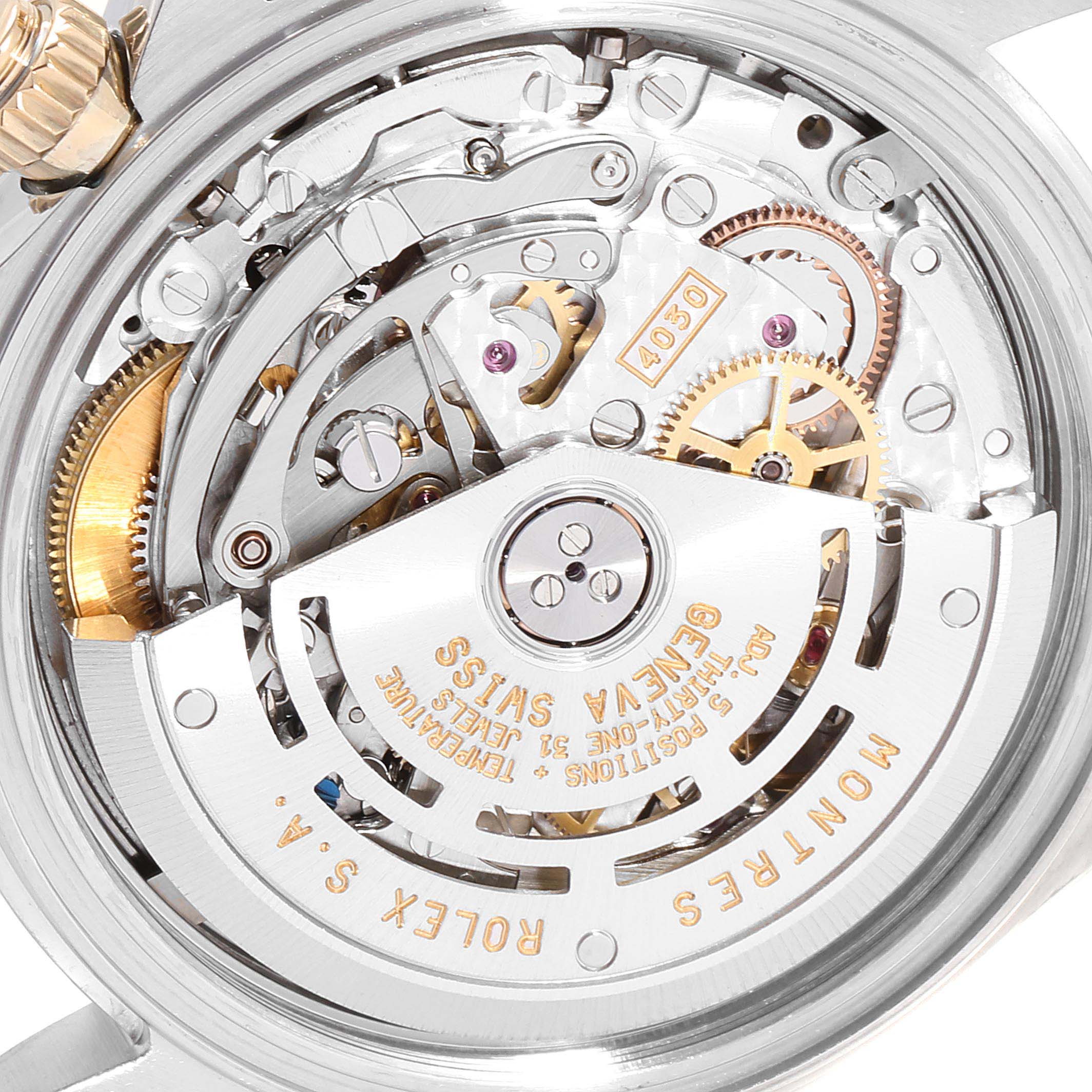 This image shows the intricate internal mechanism of a Rolex Daytona 116523 Men
s Steel and Gold (two tone) White Dial 116523 Men
s Steel and Gold (two tone) White Dial watch, viewed from the back.