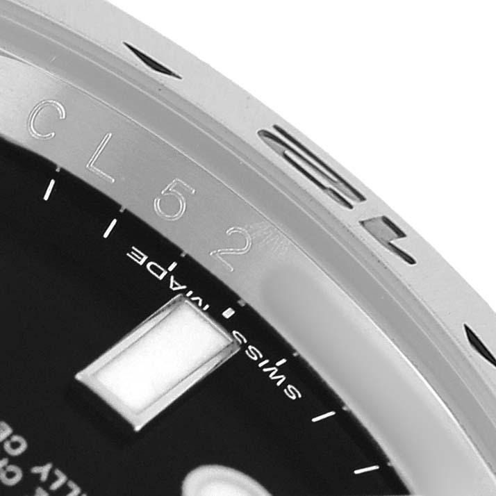 The image shows a close-up of the bezel and dial edge of a Rolex Explorer 216570 Men's Stainless Steel Black Dial, featuring part of the engraved inner ring.