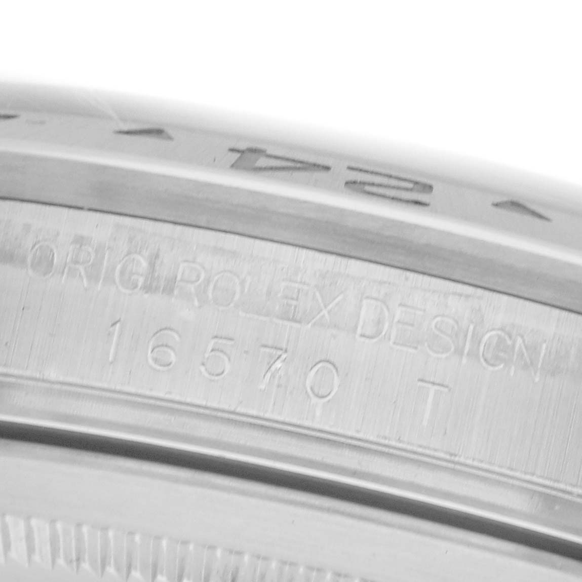 The image shows a close-up of the engraved inner bezel of a Rolex Explorer 16570 Men's Stainless Steel Black Dial 16570 Men's Stainless Steel Black Dial watch, highlighting its model number.