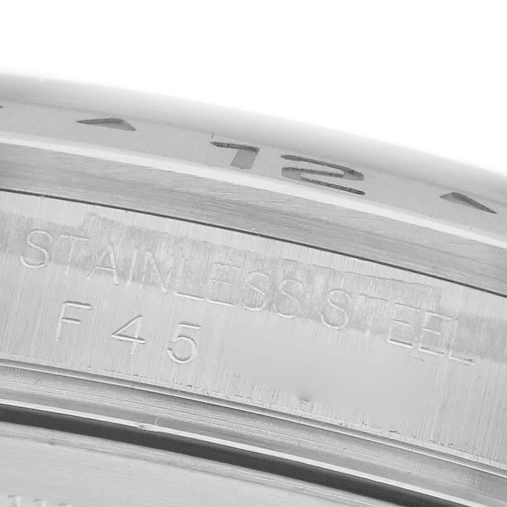 The image shows a close-up of the stainless steel case side engraving on a Rolex Explorer 16570 Men's Stainless Steel Black Dial 16570 Men's Stainless Steel Black Dial watch.