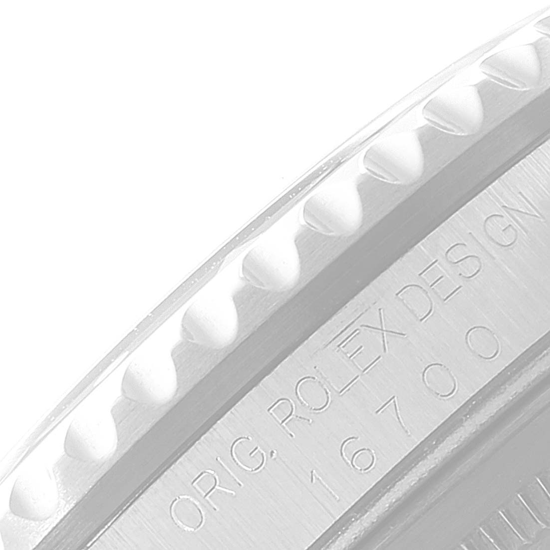 The image shows a close-up side angle of the bezel and part of the engraved casing of the Rolex GMT-Master 16700 Men
s Stainless Steel Black Dial 16700 Men
s Stainless Steel Black Dial, displaying the model number 16700.