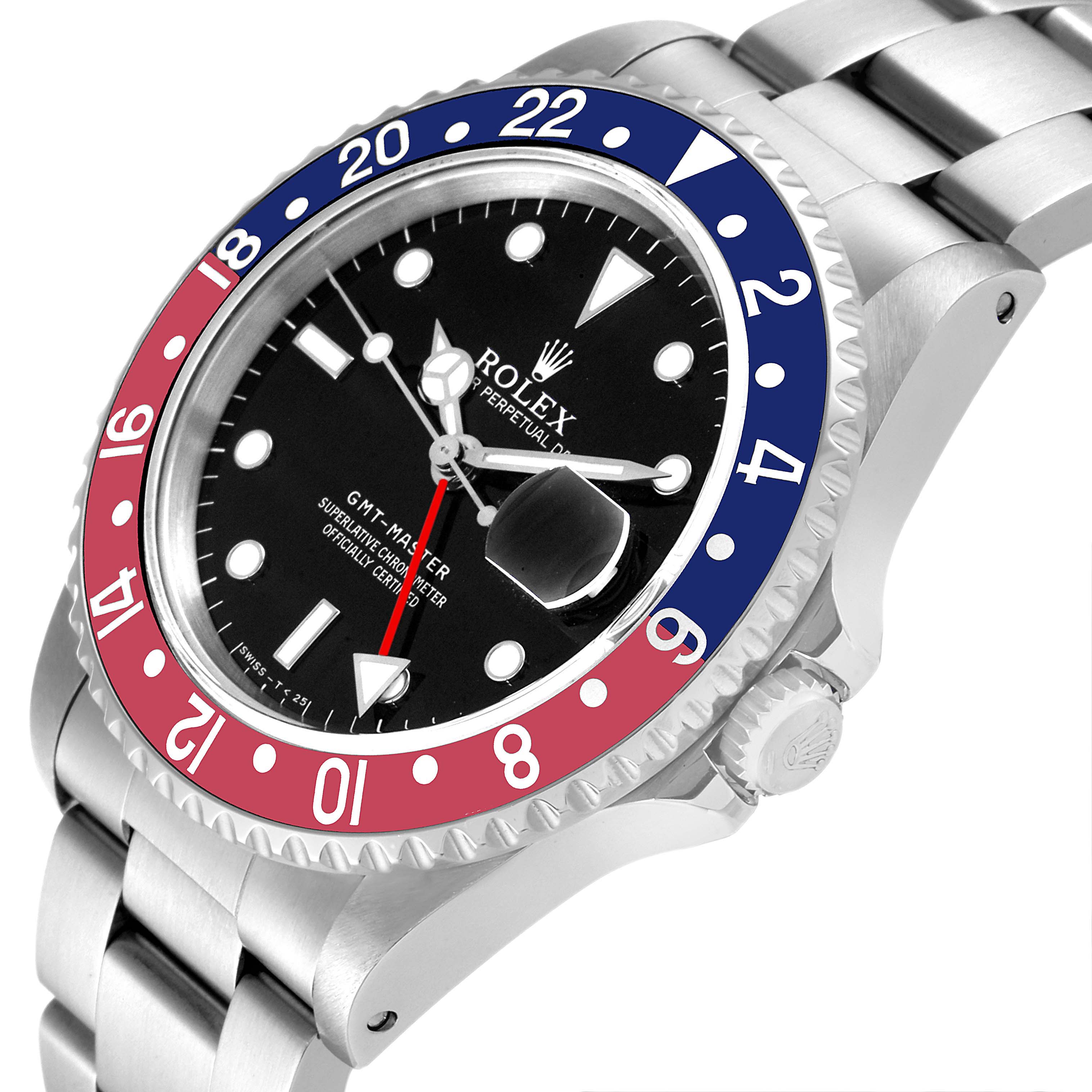 The image shows a Rolex GMT-Master 16700 Men
s Stainless Steel Black Dial 16700 Men
s Stainless Steel Black Dial watch at an angled view, highlighting the bezel, dial, crown, and part of the bracelet.
