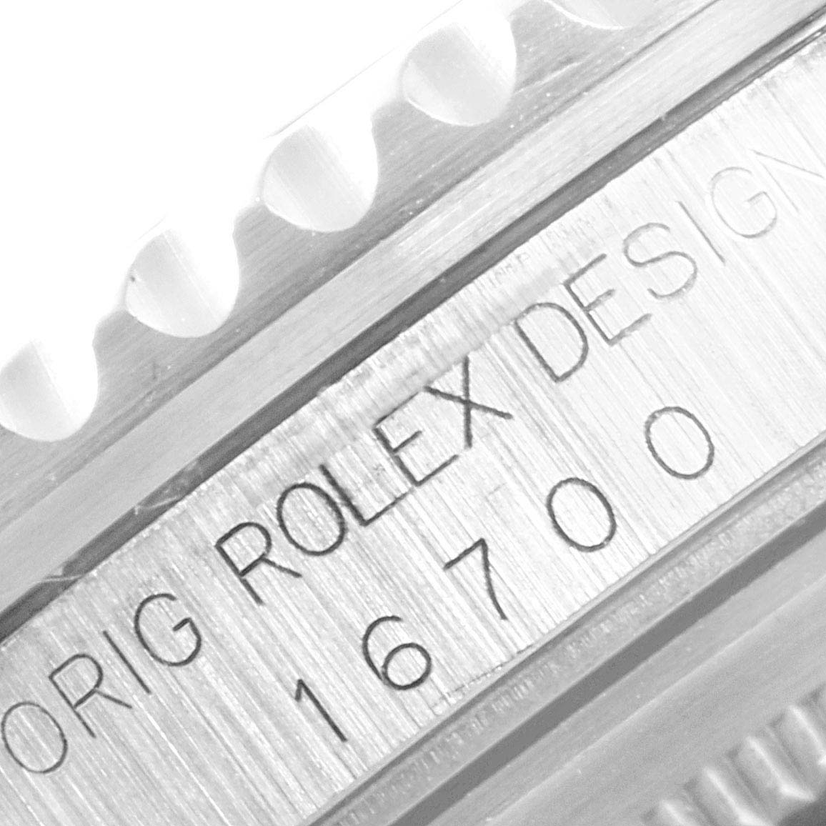 The angle is a close-up side view showing the reference number and part of the bezel of the Rolex GMT-Master 16700 Men's Stainless Steel Black Dial 16700 Men's Stainless Steel Black Dial model.