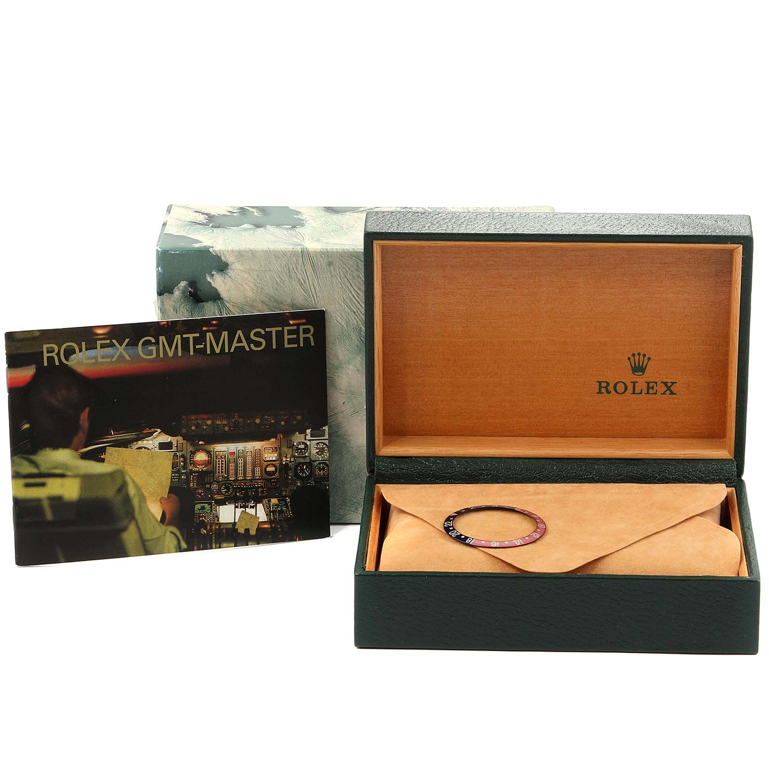 The image displays the Rolex GMT-Master 16700 Men's Stainless Steel Black Dial 16700 Men's Stainless Steel Black Dial watch accessories, including a bezel ring, box, and booklet from a front angle.