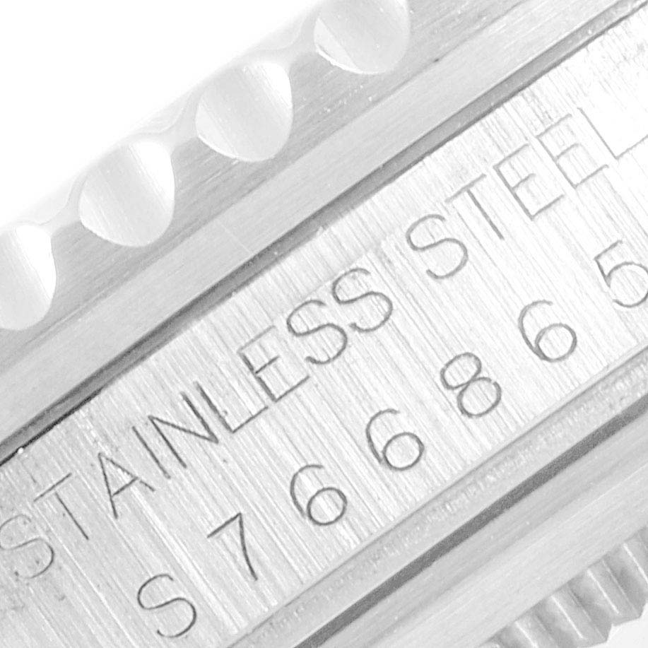 The image shows a close-up angle of the side of a Rolex GMT-Master 16700 Men's Stainless Steel Black Dial 16700 Men's Stainless Steel Black Dial watch, highlighting the stainless steel engraving and part of the bezel.