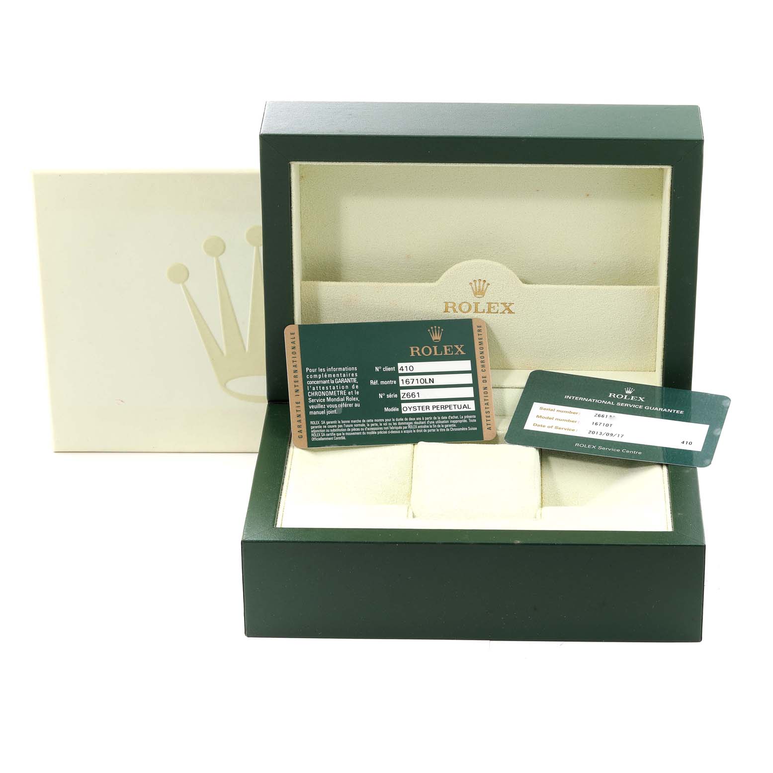 The image shows an open Rolex GMT-Master 16710 Men
s Stainless Steel Black Dial 16710 Men
s Stainless Steel Black Dial watch box with two warranty cards inside.