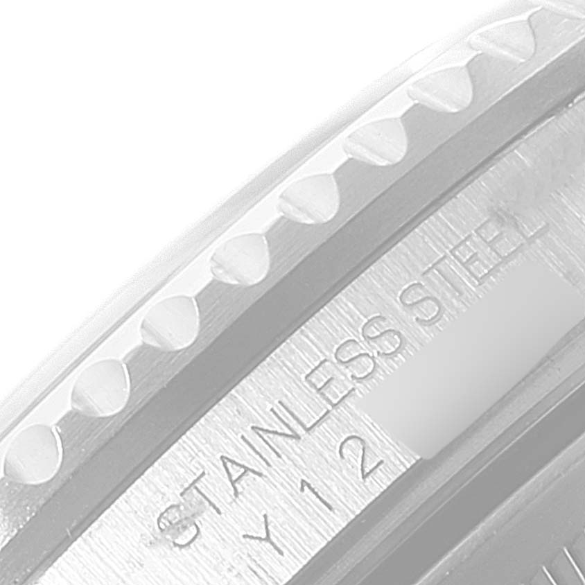 This close-up image displays the stainless steel bezel and part of the inscription on a Rolex GMT-Master 16710 Men
s Stainless Steel Black Dial 16710 Men
s Stainless Steel Black Dial watch.