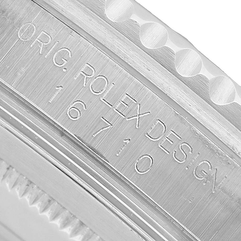 The image shows a close-up of the side engraving on the Rolex GMT-Master 16710 Men's Stainless Steel Black Dial, highlighting "Orig. Rolex Design" and the model number 16710.