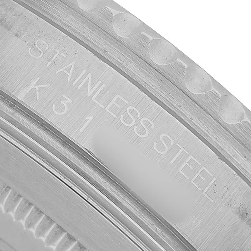 The image shows a close-up of the stainless steel case side with engravings for the Rolex GMT-Master 16710 Men's Stainless Steel Black Dial.