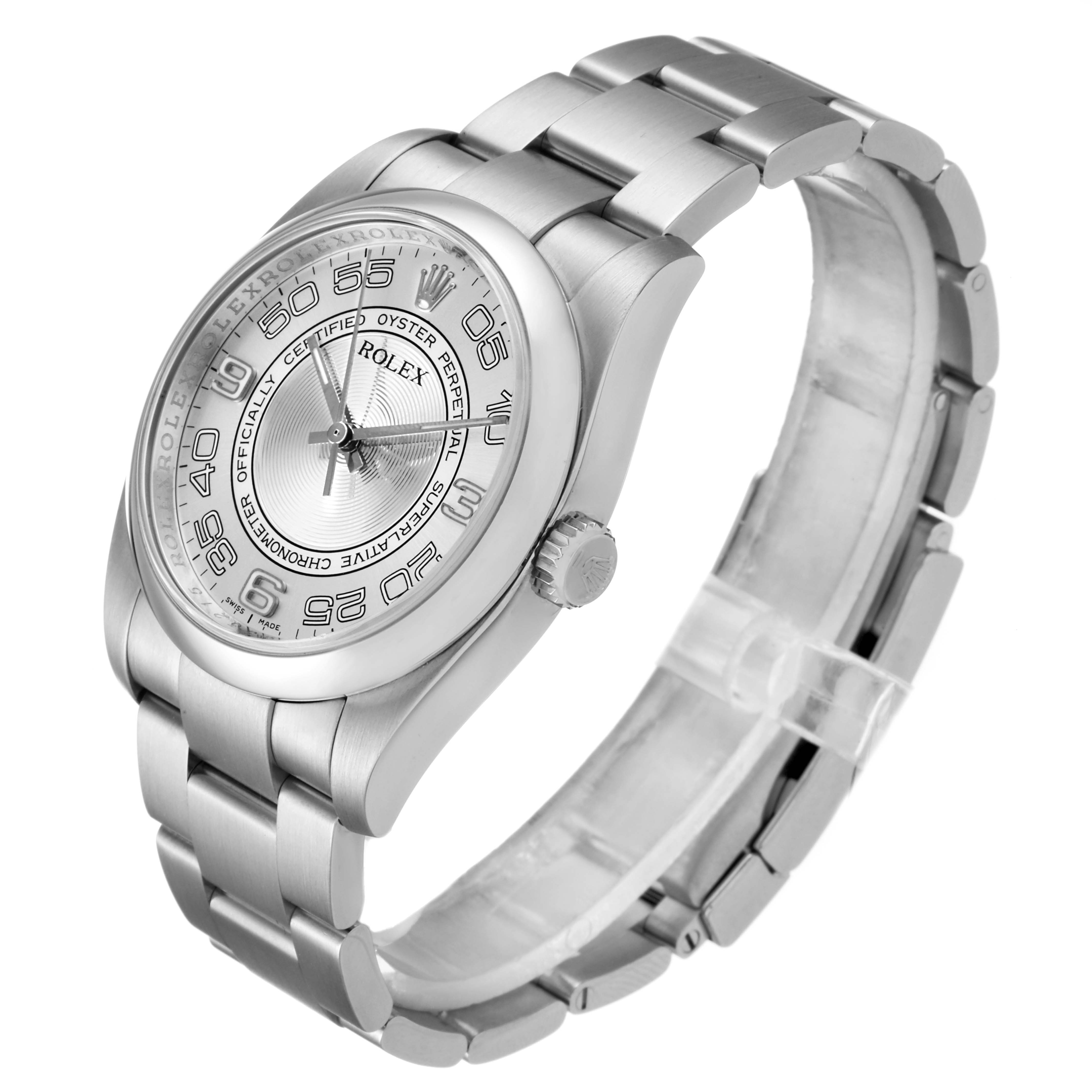 The Rolex Oyster Perpetual 116000 Men's Stainless Steel Silver Dial 116000 Men's Stainless Steel Silver Dial watch is shown from a front-left side angle displaying the dial, bezel, crown, and bracelet.