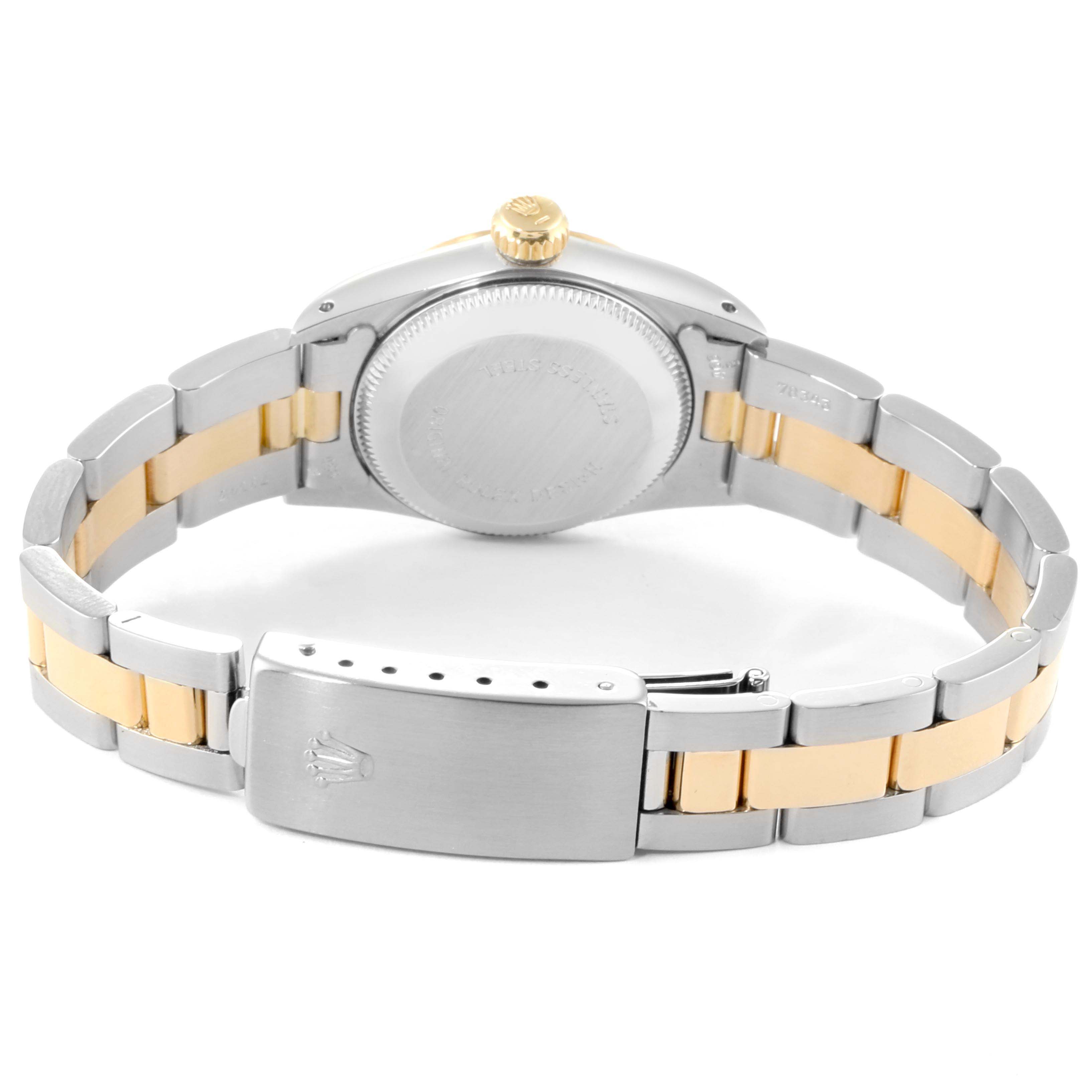 The image shows the back view of a Rolex Oyster Perpetual 67193 Women
s Steel and Gold (two tone) White Dial 67193 Women
s Steel and Gold (two tone) White Dial watch, highlighting the case back and two-tone bracelet with clasp.