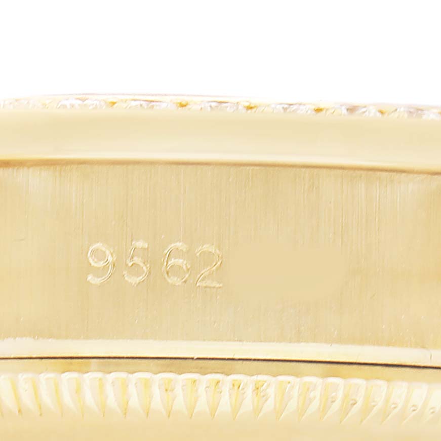 The image shows the side profile of a Rolex President 79138 Women's Yellow Gold Champagne Dial watch, focusing on the case edge and engravings.