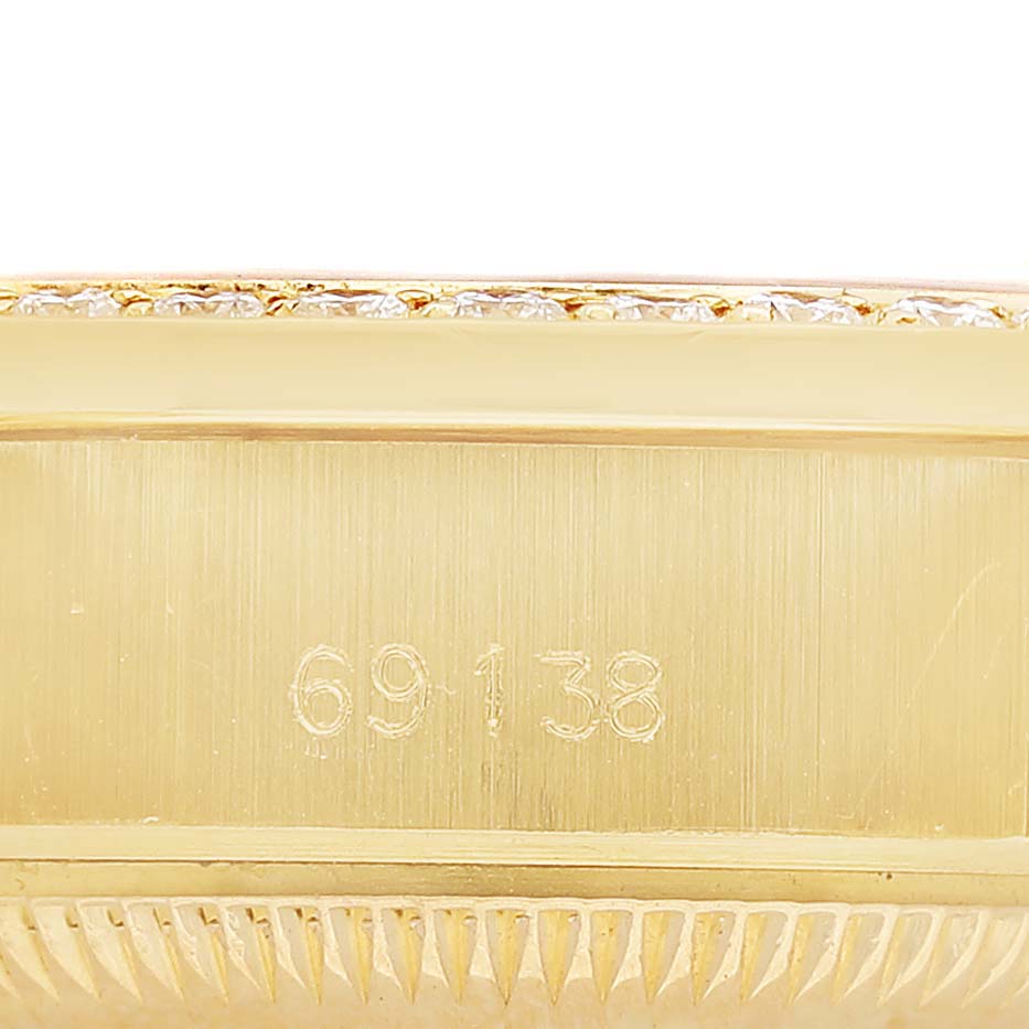 The image shows a close-up of the side of the Rolex President 79138 Women's Yellow Gold Champagne Dial model, highlighting the case number and part of the bezel.