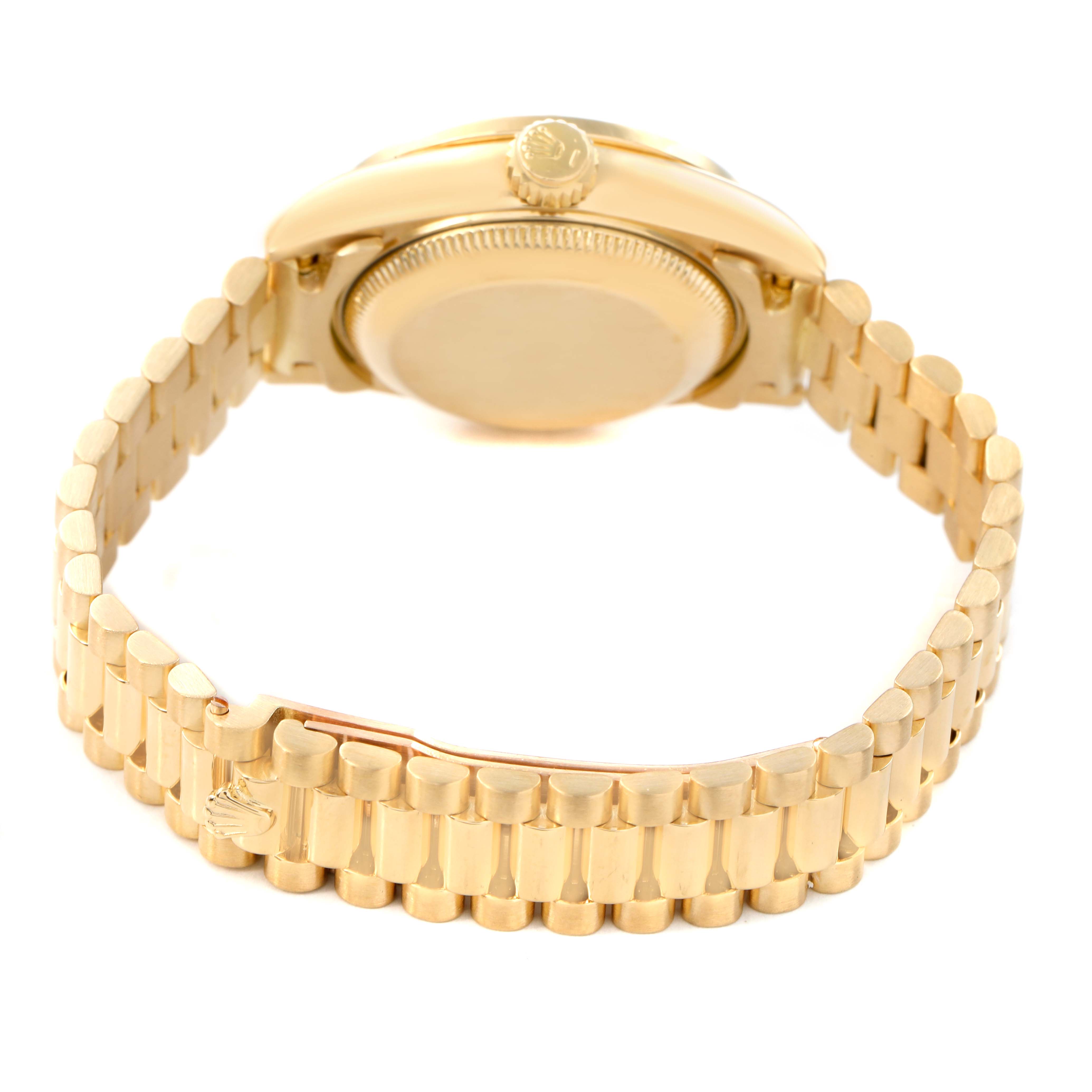 The image shows the back and side view of a Rolex President 79138 Women's Yellow Gold Champagne Dial watch, highlighting the crown and part of the bracelet.