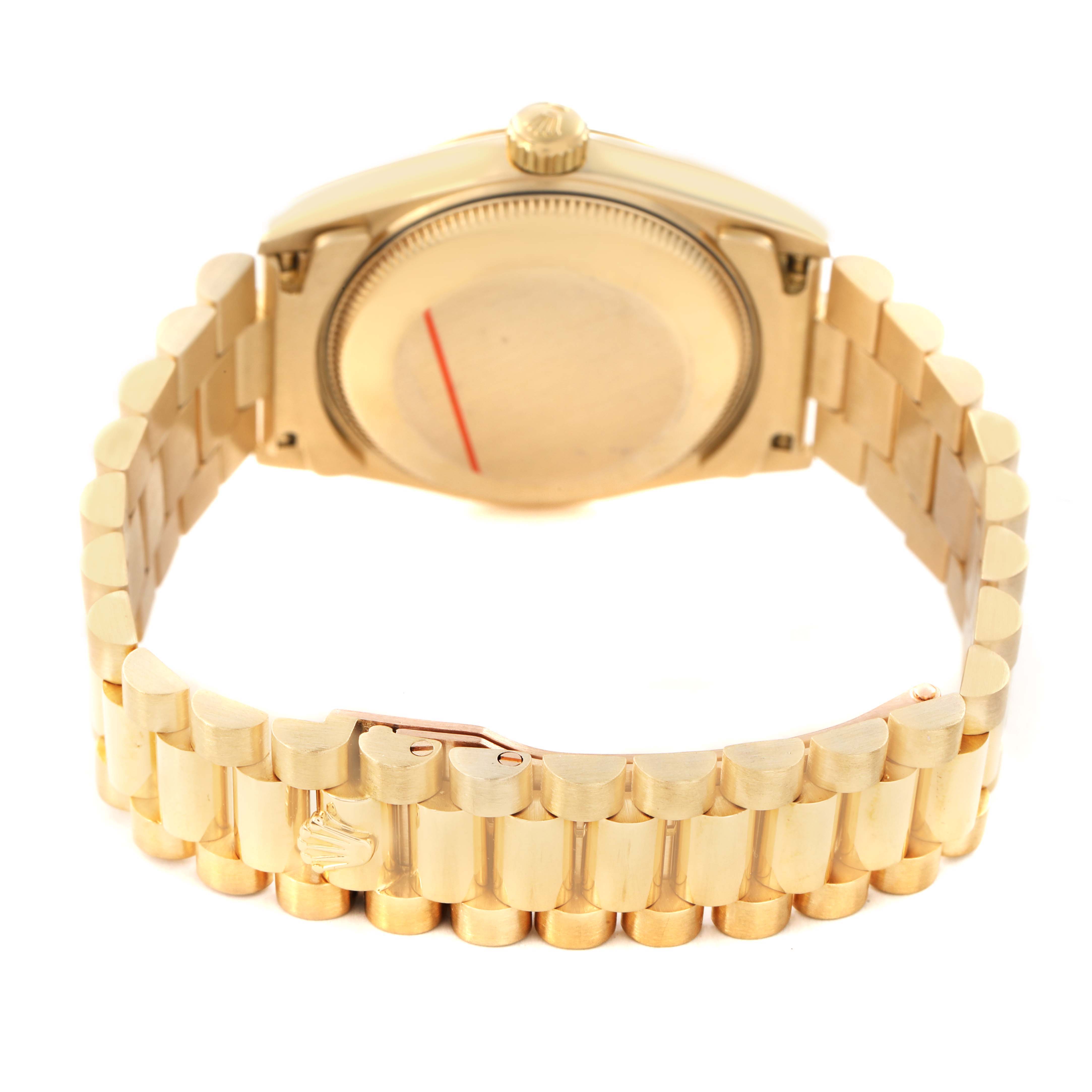 The image shows the back and clasp of a Rolex Datejust 68278 Women's Yellow Gold White Dial, featuring its gold bracelet and case back.