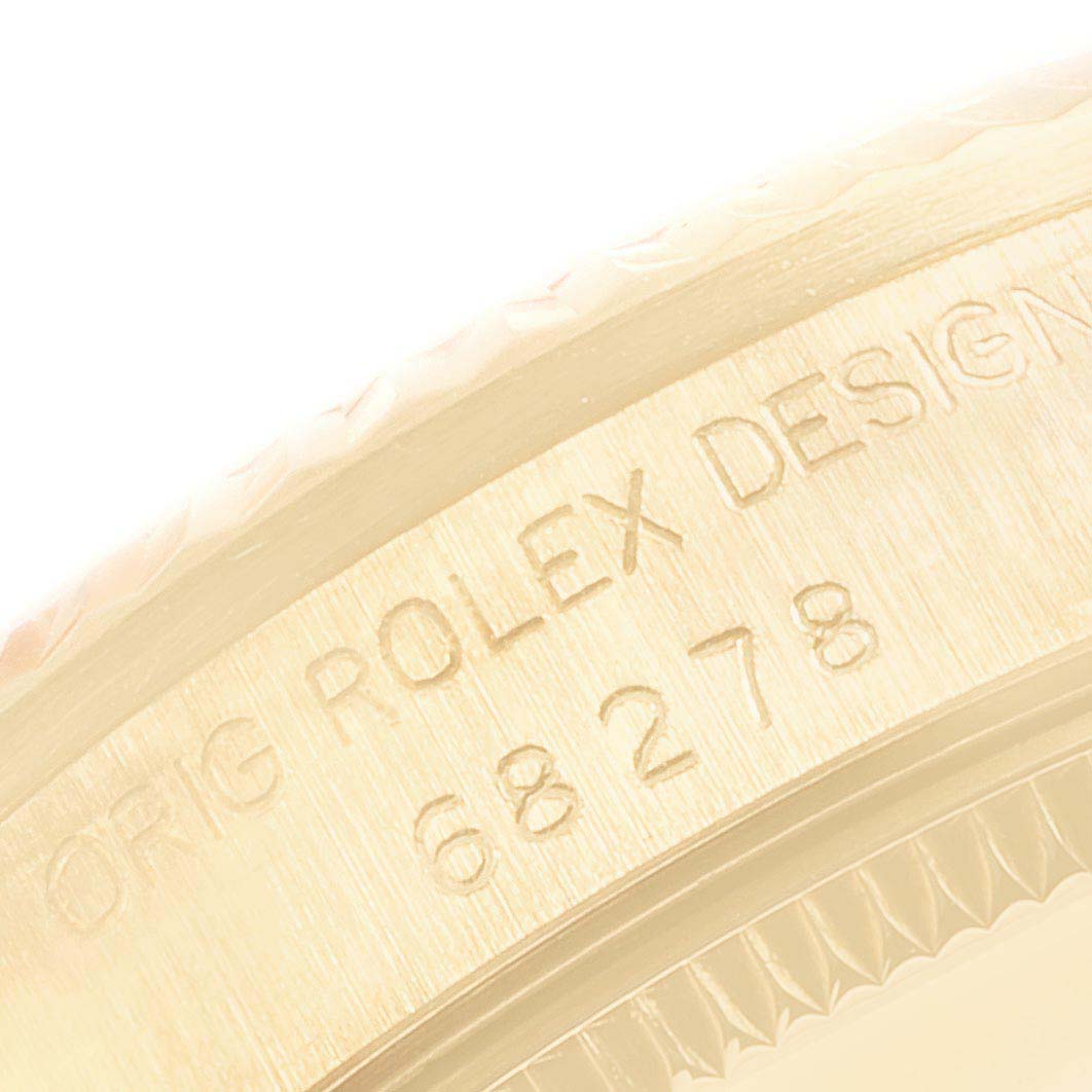 The image shows an angled close-up of the serial number engraving on a Rolex President 68278 Women
s Yellow Gold Champagne Dial 68278 Women
s Yellow Gold Champagne Dial model watch.