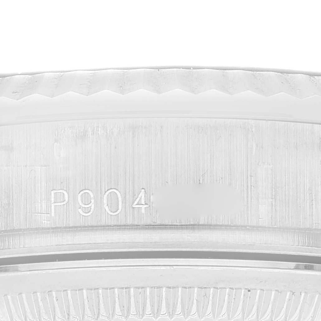 This image shows a close-up view of the serial number engraving on the case of a Rolex President 118339 Men's White Gold Black Dial 118339 Men's White Gold Black Dial model watch.