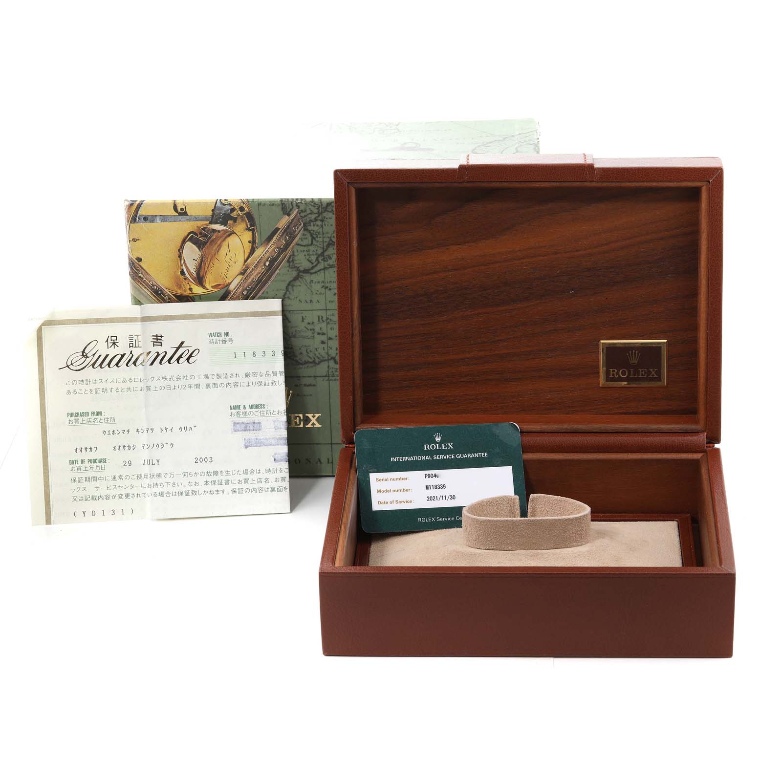 The image shows the packaging box and documentation for the Rolex President 118339 Men's White Gold Black Dial 118339 Men's White Gold Black Dial model watch, including guarantee papers and an inner cushion.