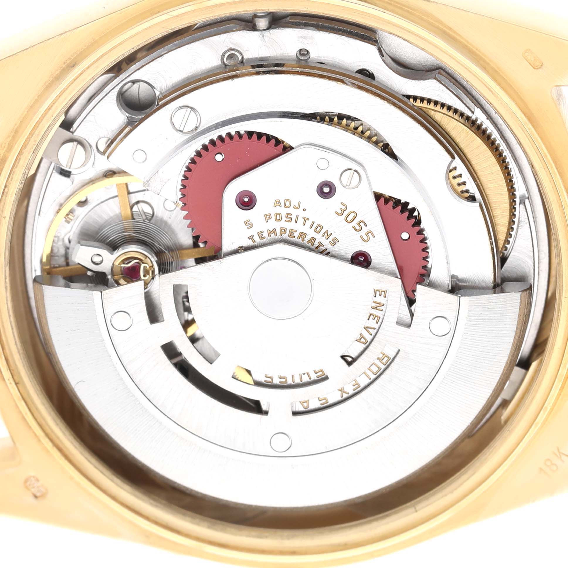 The image shows the movement of a Rolex President 18038 Men's Yellow Gold Champagne Dial model watch, highlighting its gears and rotor from a top view.