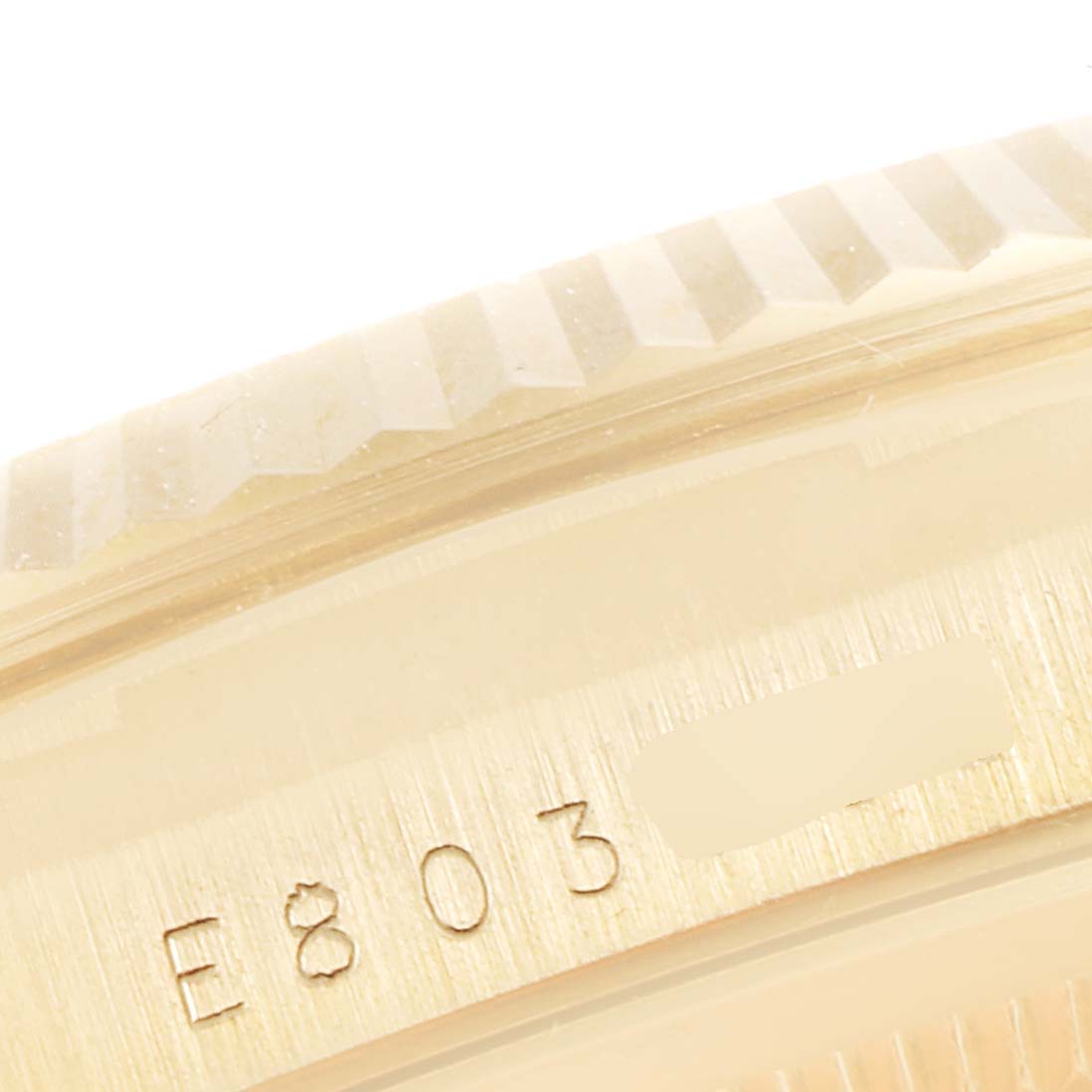 This close-up image shows the engraved numbers on the case of a Rolex President 18238 Men
s Yellow Gold Champagne Dial 18238 Men
s Yellow Gold Champagne Dial model watch.