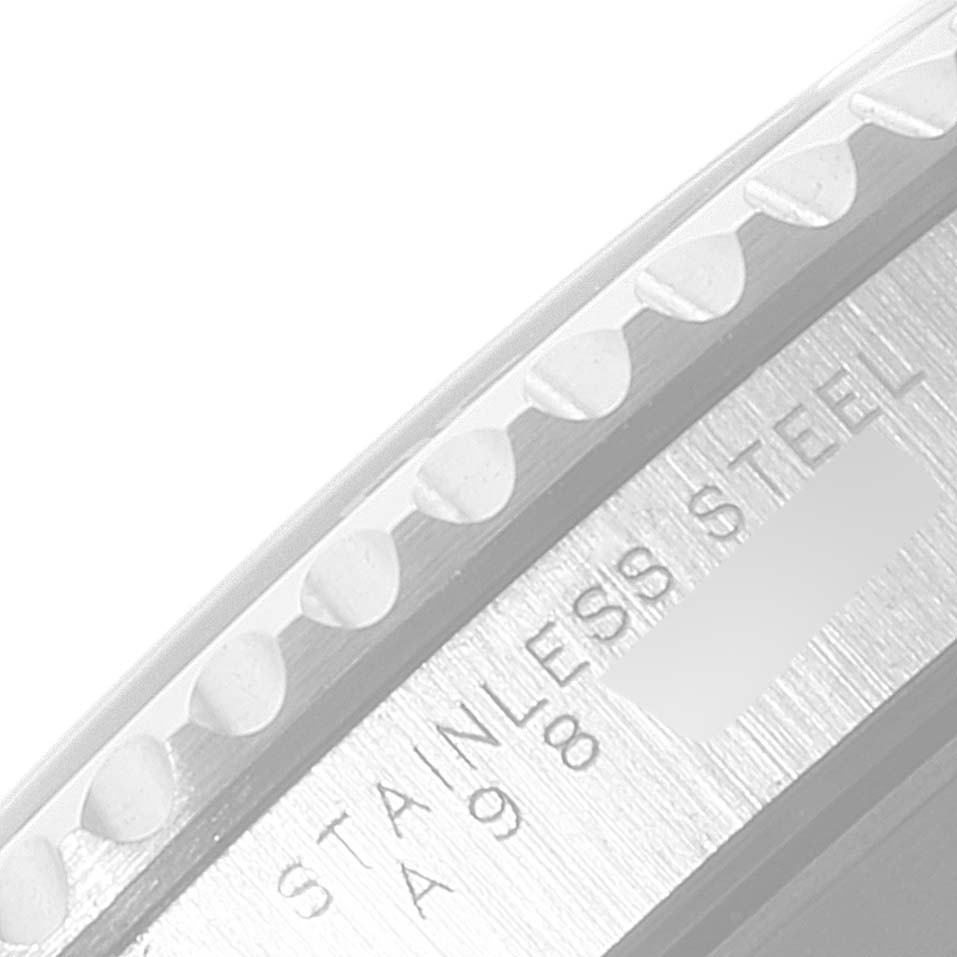 The image shows a close-up of the bezel and the side of the case of a Rolex Submariner 14060 Men's Stainless Steel Black Dial 14060 Men's Stainless Steel Black Dial, highlighting the "STAINLESS STEEL" engraving.