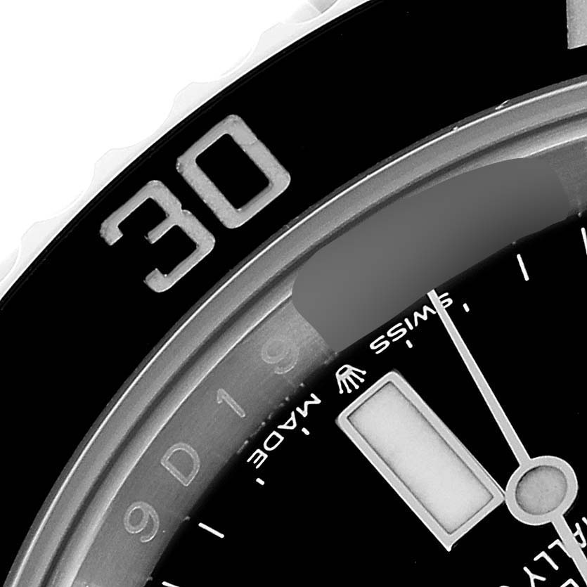 This image shows a close-up of the bezel, dial, and minute hand of a Rolex Submariner 124060 Men
s Stainless Steel Black Dial 124060 Men
s Stainless Steel Black Dial watch.