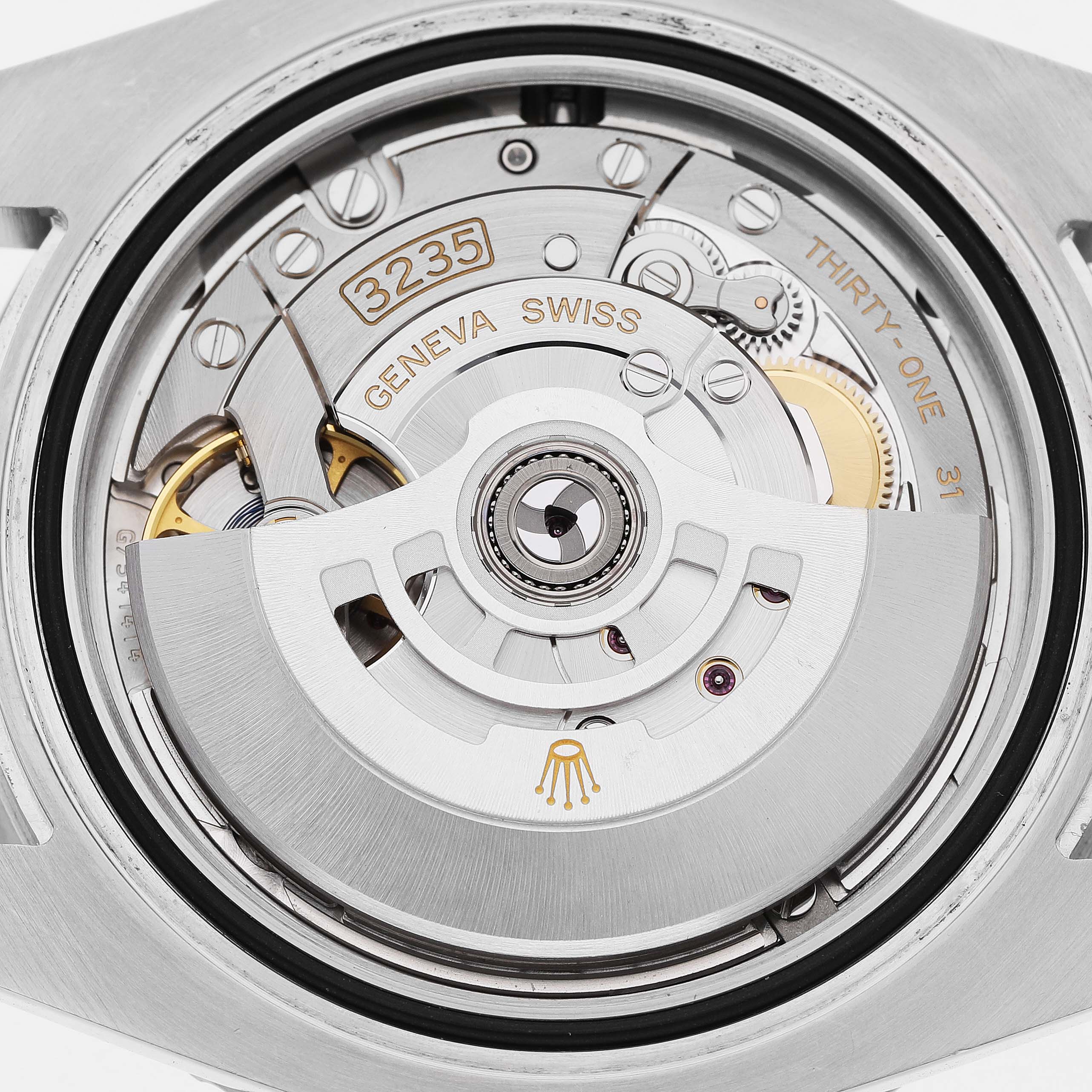 The image shows a close-up of the Rolex Submariner 126610LN Men's Stainless Steel Black Dial's movement, highlighting the rotor and internal components from the back.