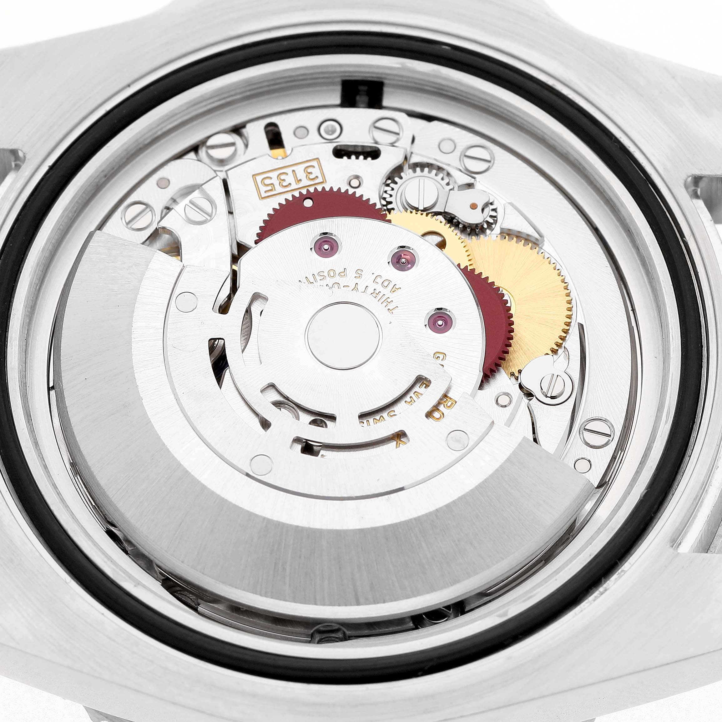 The image shows the back view of a Rolex Submariner 116610LV Men's Stainless Steel Green Dial watch, highlighting its intricate movement and internal components.