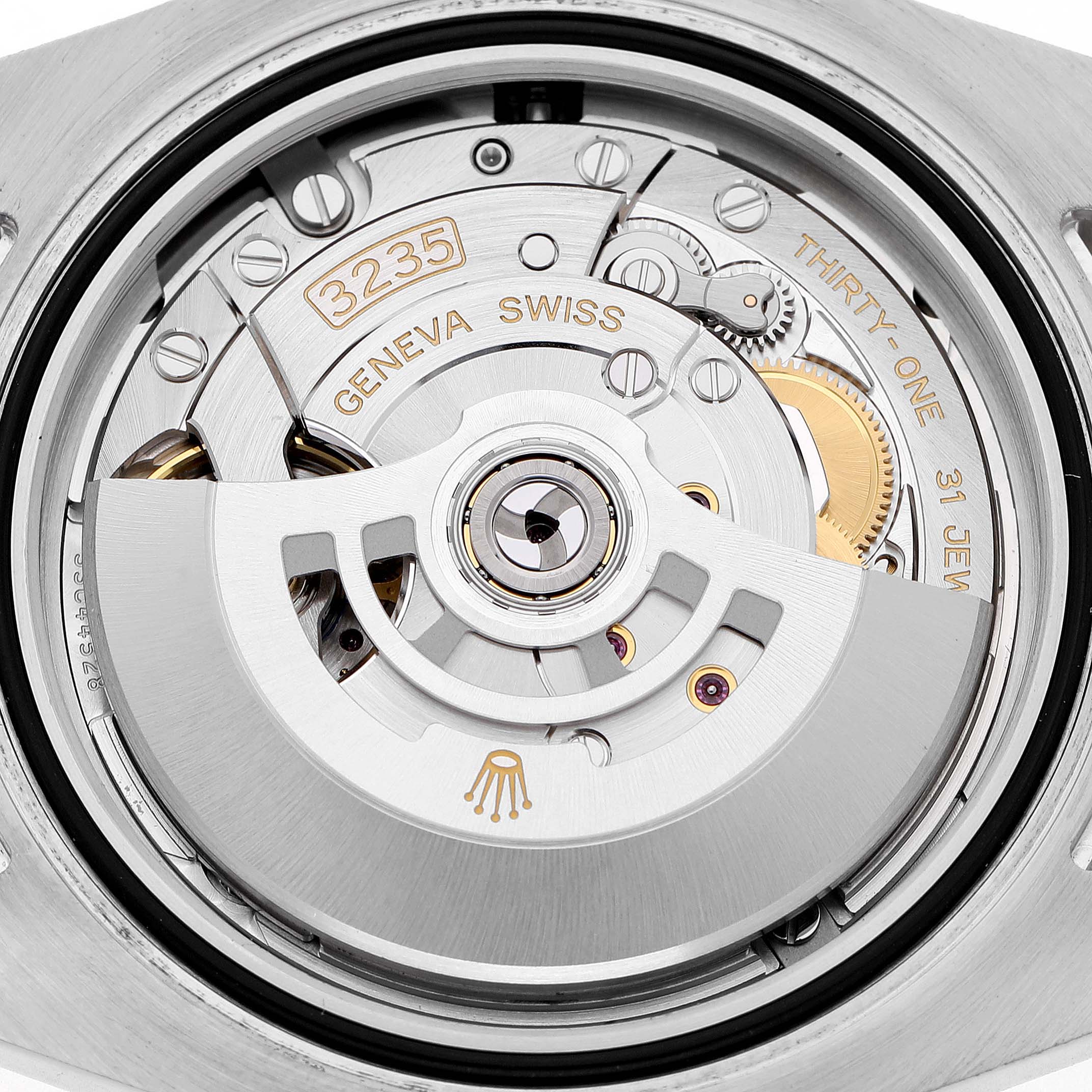 The image shows the movement of the Rolex Submariner 126610LV Men's Stainless Steel Black Dial, viewed from the back, highlighting the rotor and mechanical components.