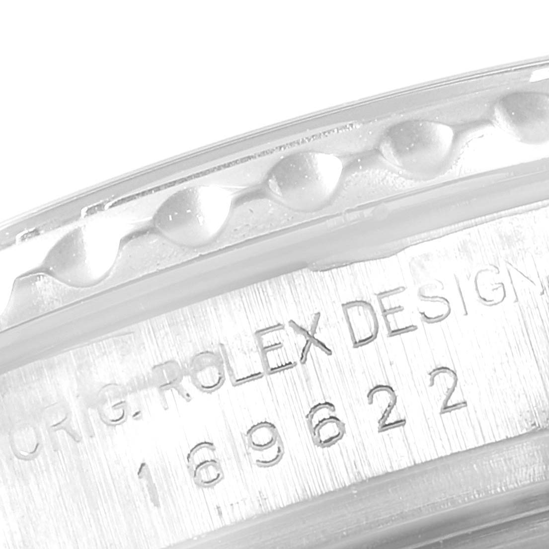 The image shows a close-up of the engraved serial number and bezel of a Rolex Yacht-Master 169622 Women's Stainless Steel Silver Dial 169622 Women's Stainless Steel Silver Dial watch.