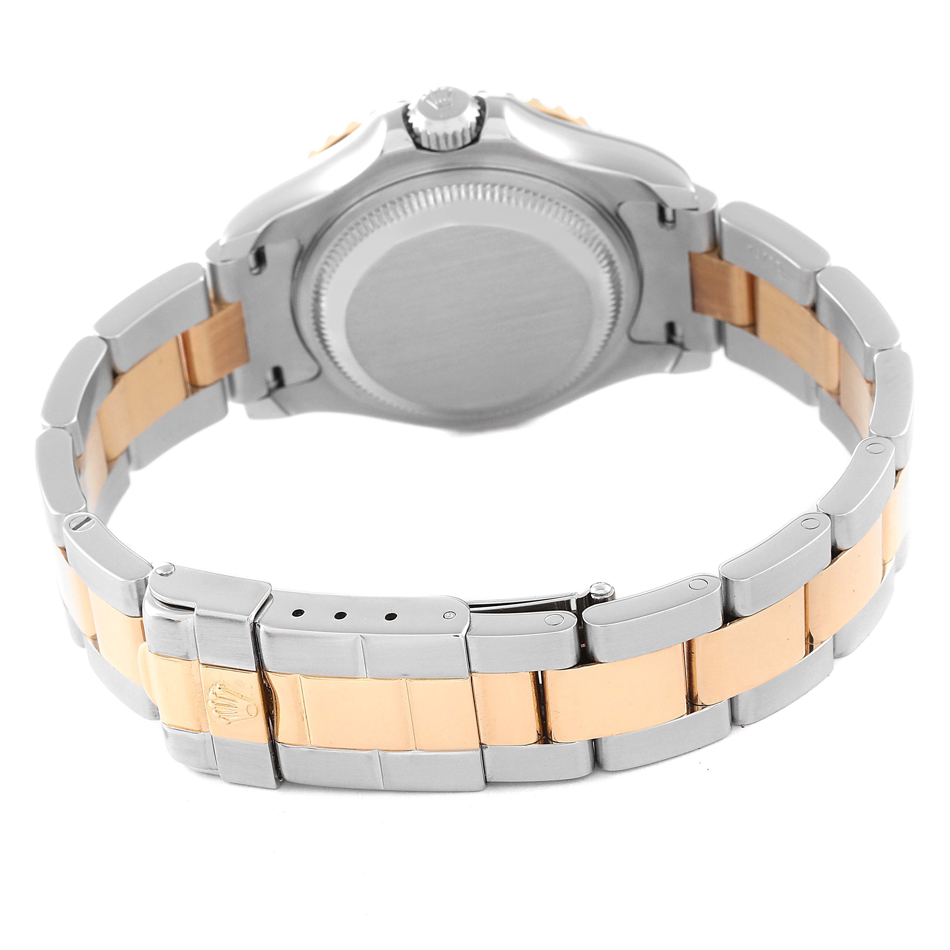 The image shows the back view of a Rolex Yacht-Master 69623 Women's Steel and Gold (two tone) White Dial 69623 Women's Steel and Gold (two tone) White Dial watch, highlighting its two-tone bracelet and clasp.