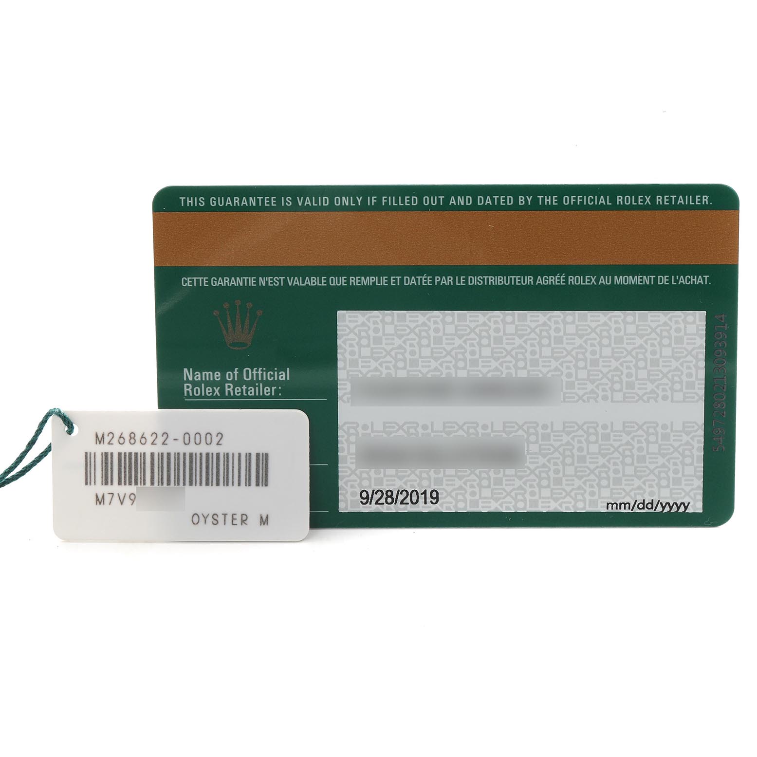 The image shows the warranty card and tag for a Rolex Yacht-Master 268622 Men
s Stainless Steel Green Dial 268622 Men
s Stainless Steel Green Dial watch.