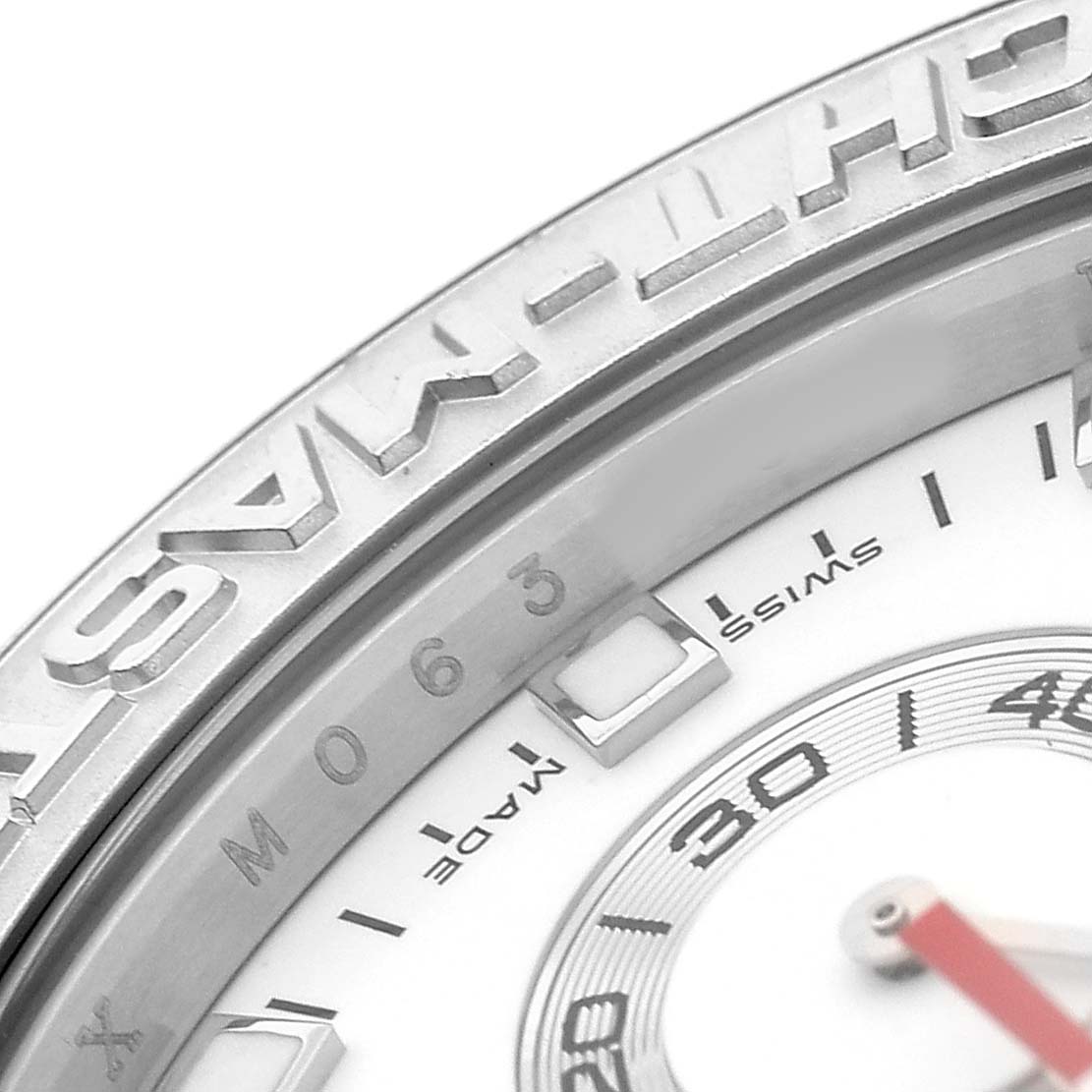 The image shows a close-up of the Rolex Yacht-Master 116689 Men's White Gold White Dial watch, highlighting the bezel, part of the dial, and the text "SWISS MADE."