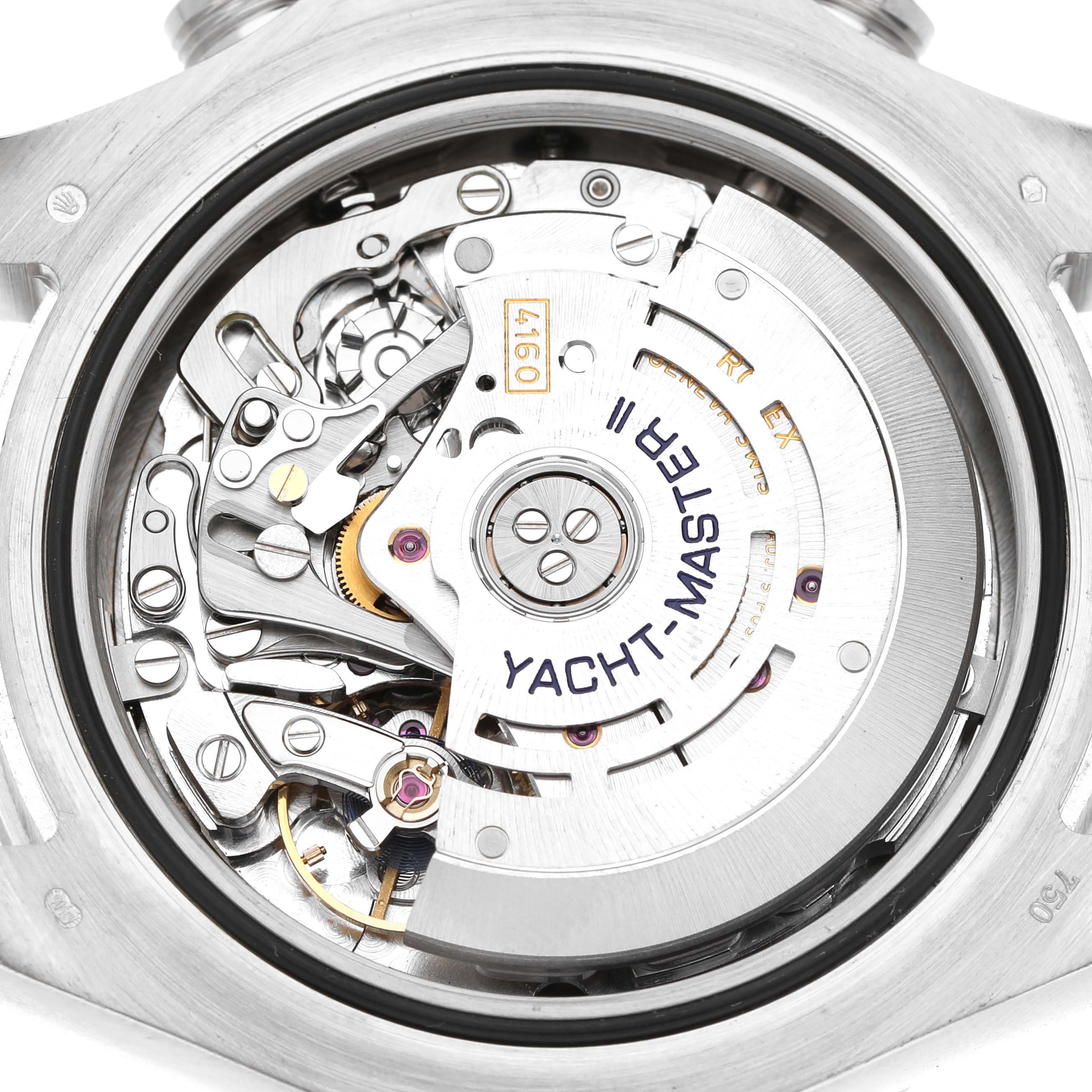 The image shows the back view of the Rolex Yacht-Master 116689 Men's White Gold White Dial, focusing on its detailed movement and internal mechanics.