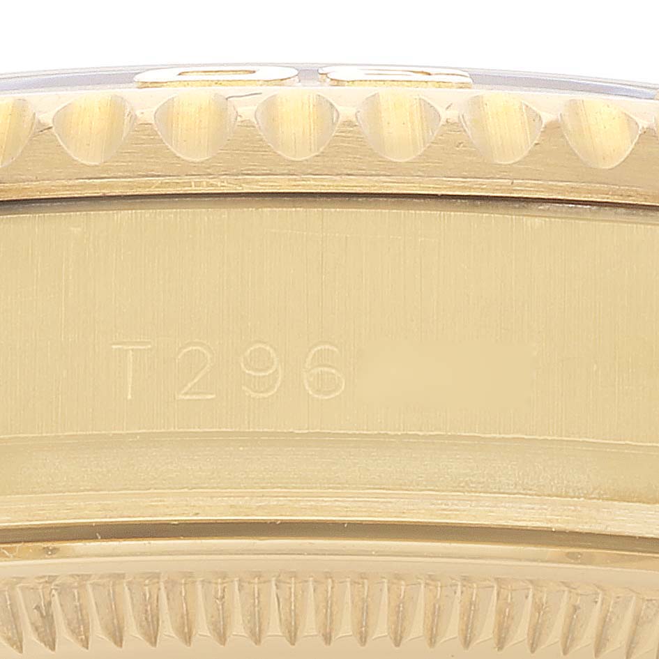 This image shows a close-up of the engraved edge and bezel of a Rolex Yacht-Master 68628 Men's Yellow Gold White Dial 68628 Men's Yellow Gold White Dial watch.