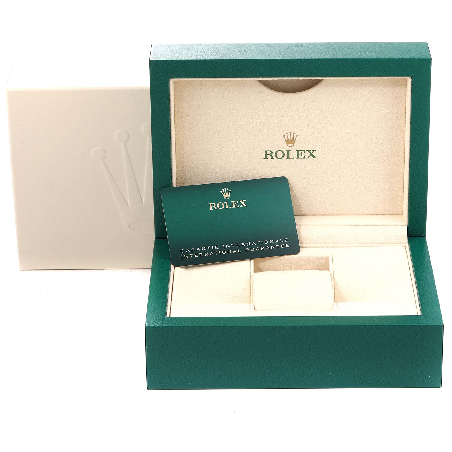 An open green Rolex box for the Yacht-Master model, showing the interior, guarantee card, and space for the watch.