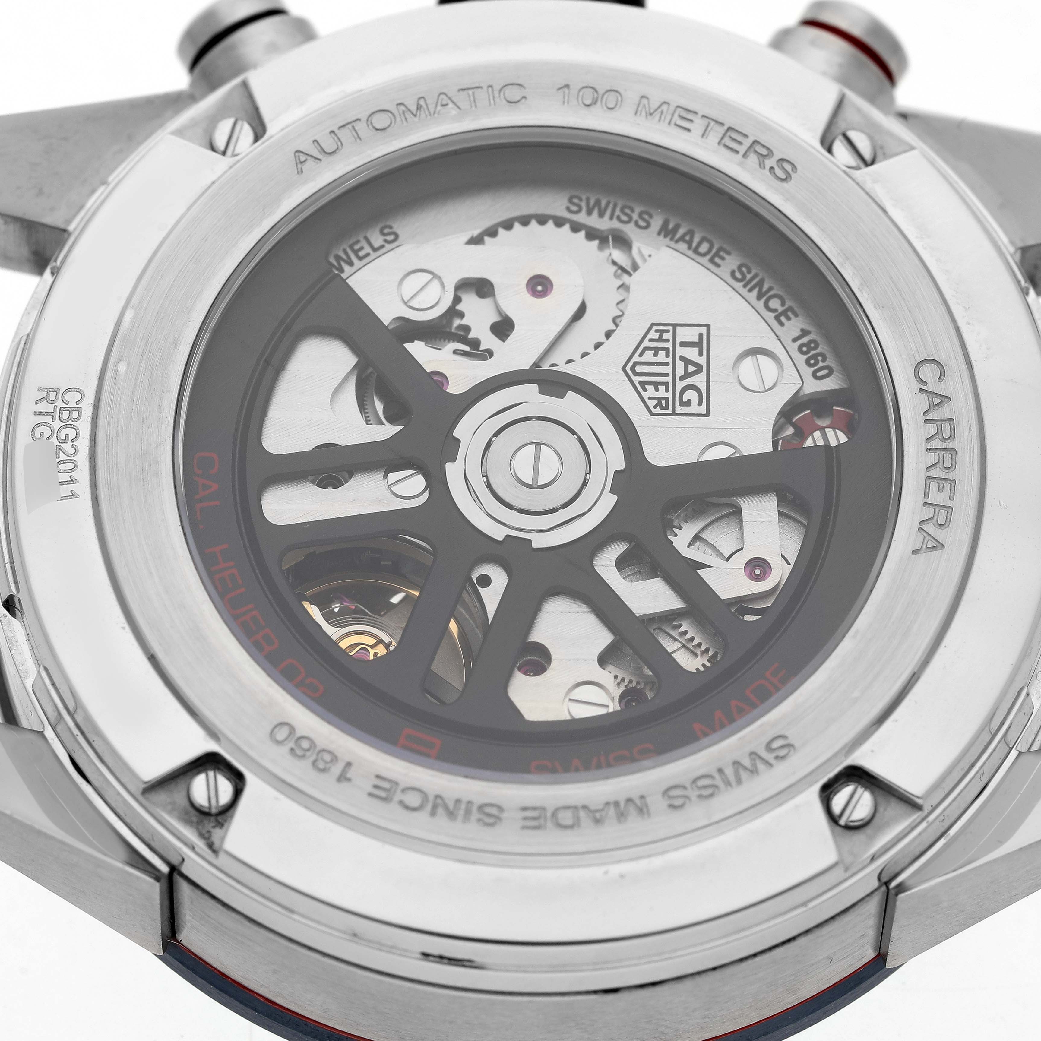 The image shows the back of a TAG Heuer Carrera watch, highlighting its automatic movement and intricate mechanics.