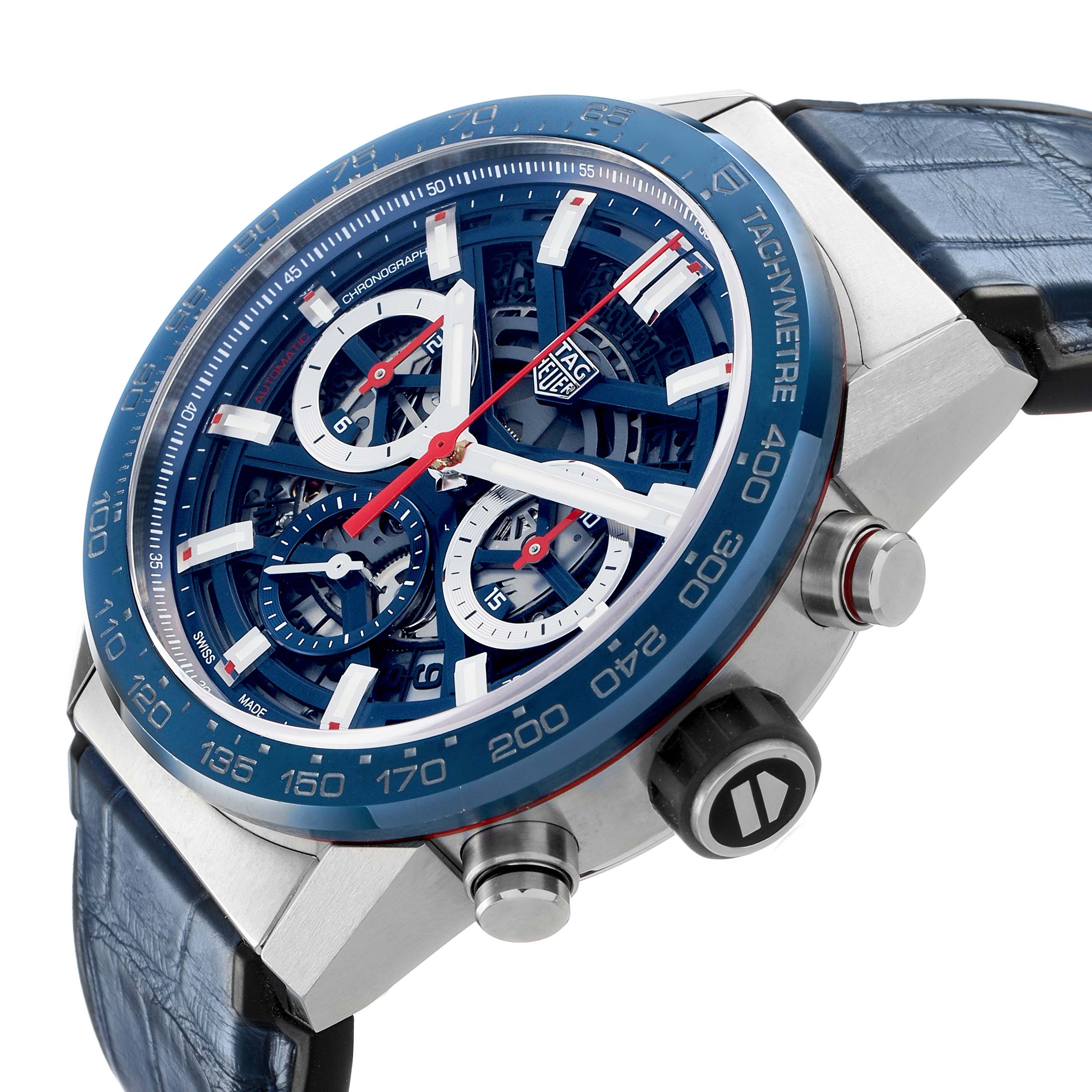 The Tag Heuer Carrera CBG2011 Men's Stainless Steel Blue Dial watch is viewed from a side angle, showcasing the blue tachymeter bezel, skeleton dial, and crown.