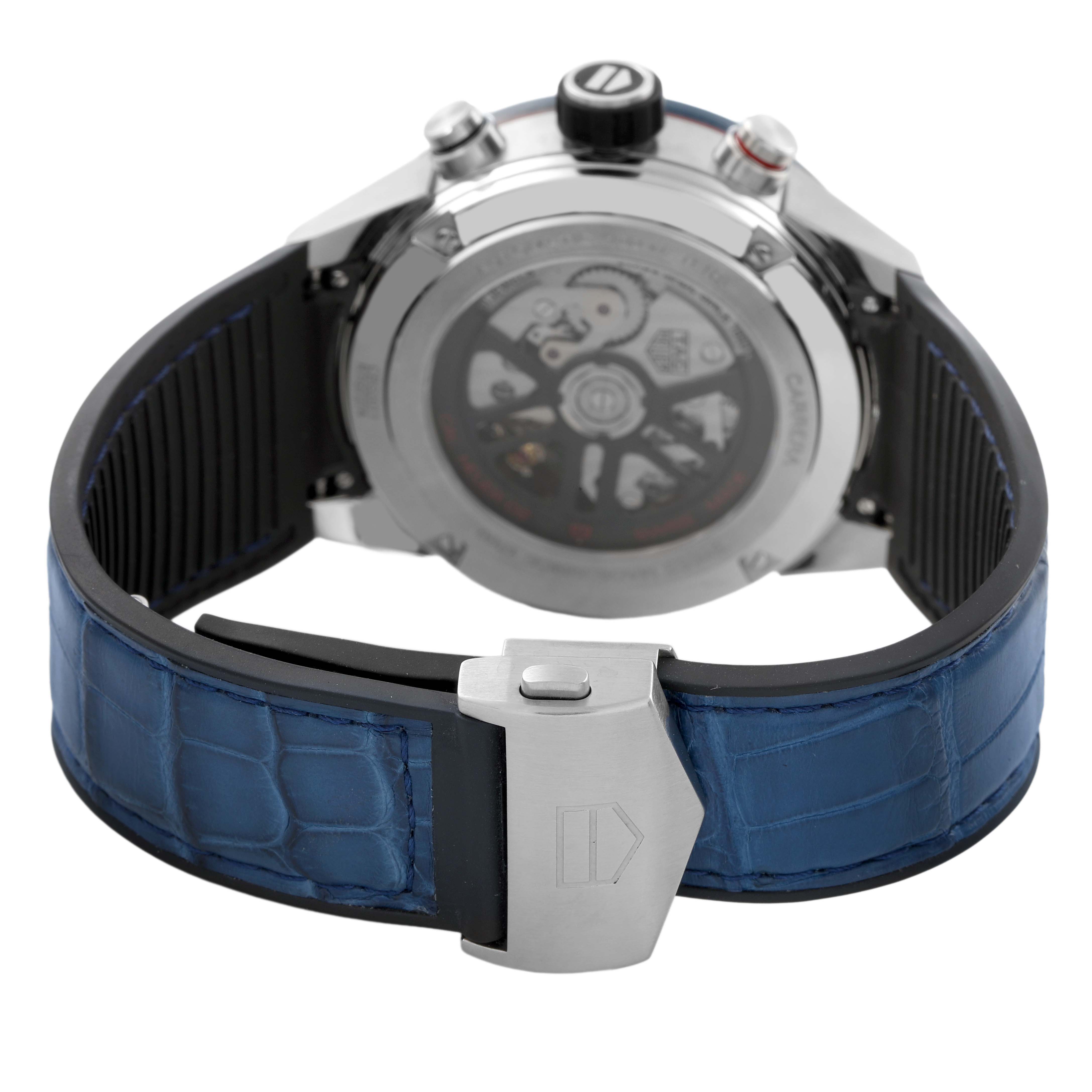 The image shows the case back and clasp of a Tag Heuer Carrera CBG2011 Men's Stainless Steel Blue Dial watch from a rear angle, highlighting the blue strap and mechanism.