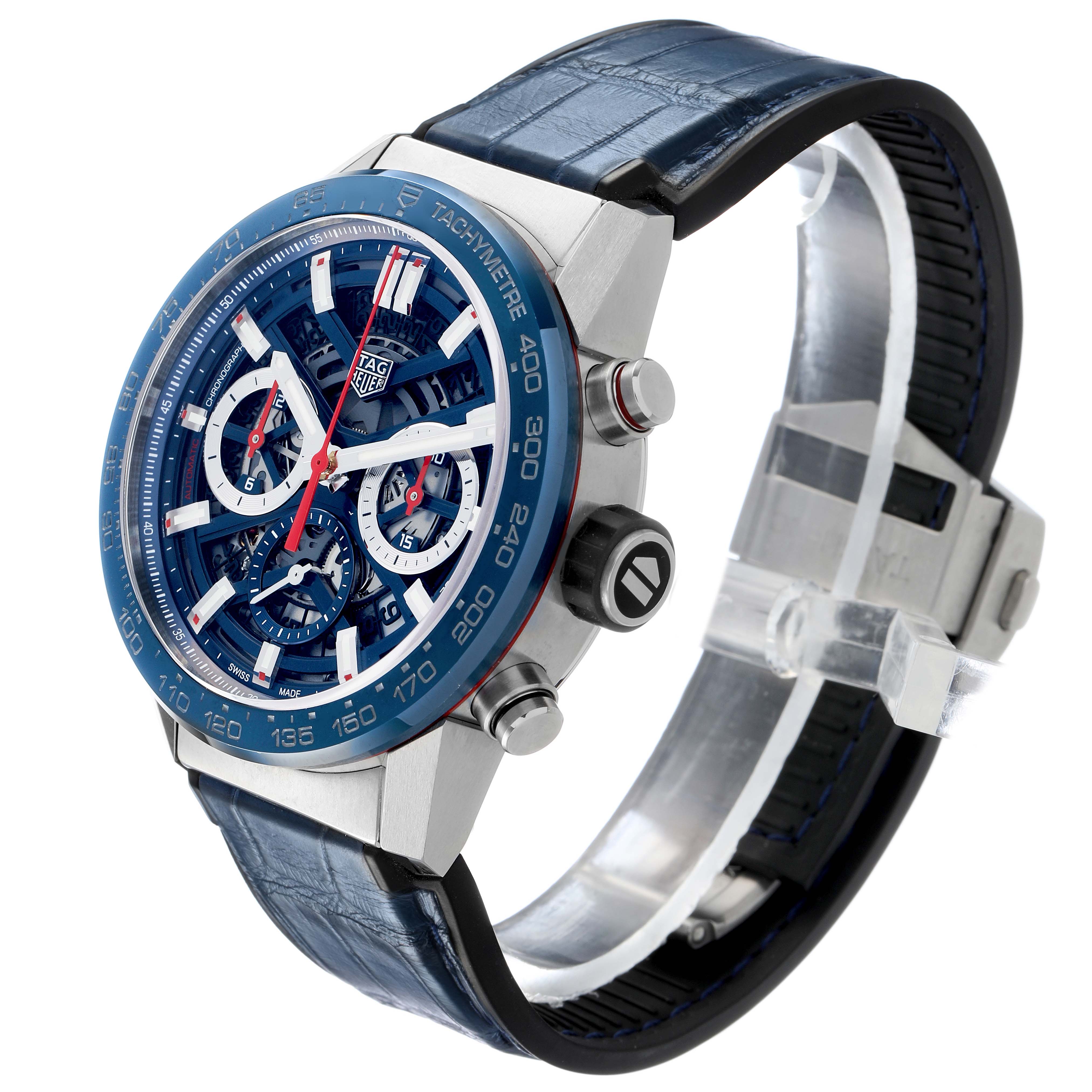 The Tag Heuer Carrera CBG2011 Men's Stainless Steel Blue Dial watch is shown at an angled side view, highlighting the face, bezel, crown, pushers, and strap buckle.