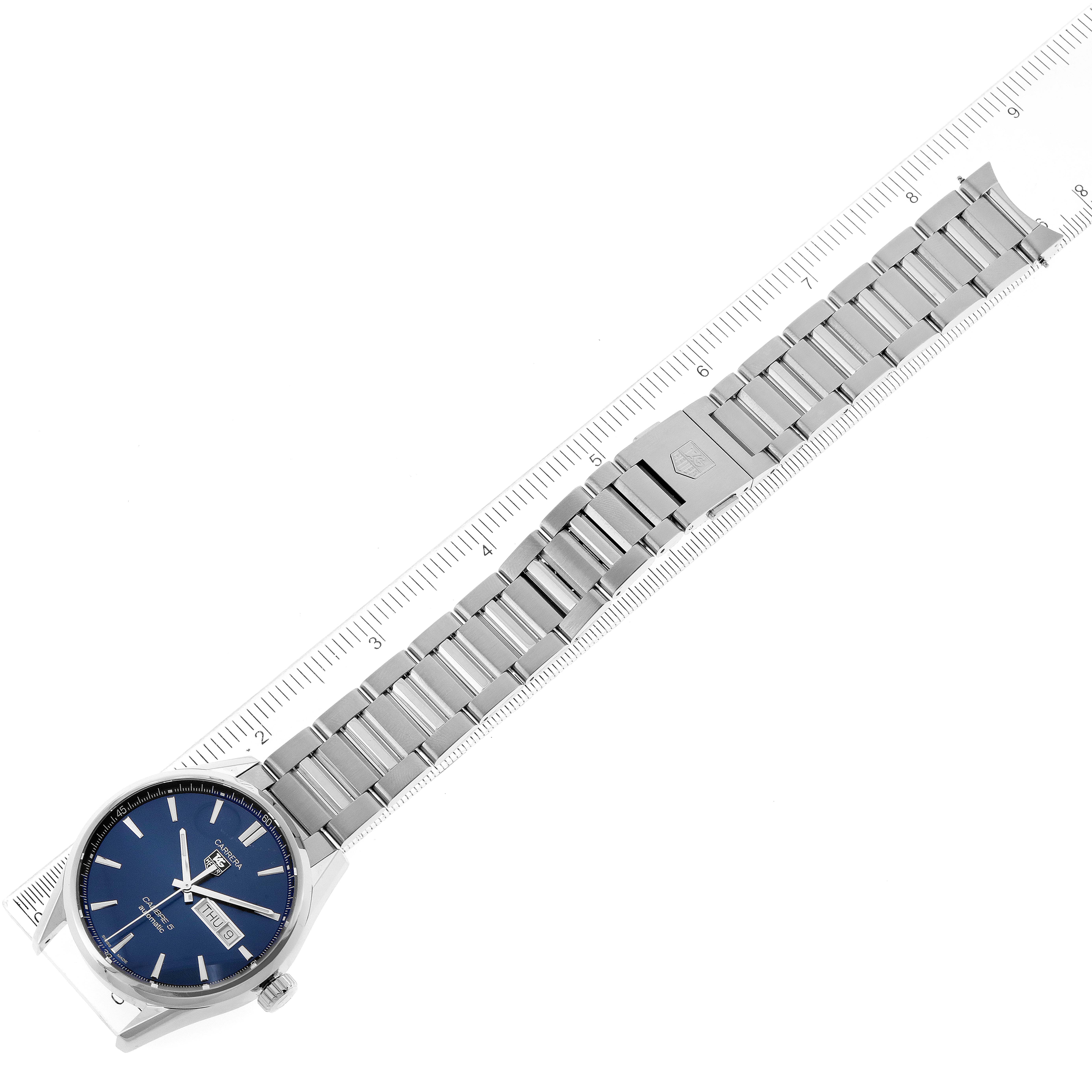 The image shows a Tag Heuer Carrera WAR201E.BA0723 Men's Stainless Steel Blue Dial WAR201E.BA0723 Men's Stainless Steel Blue Dial watch laid flat with the band extended and a ruler for measurement.