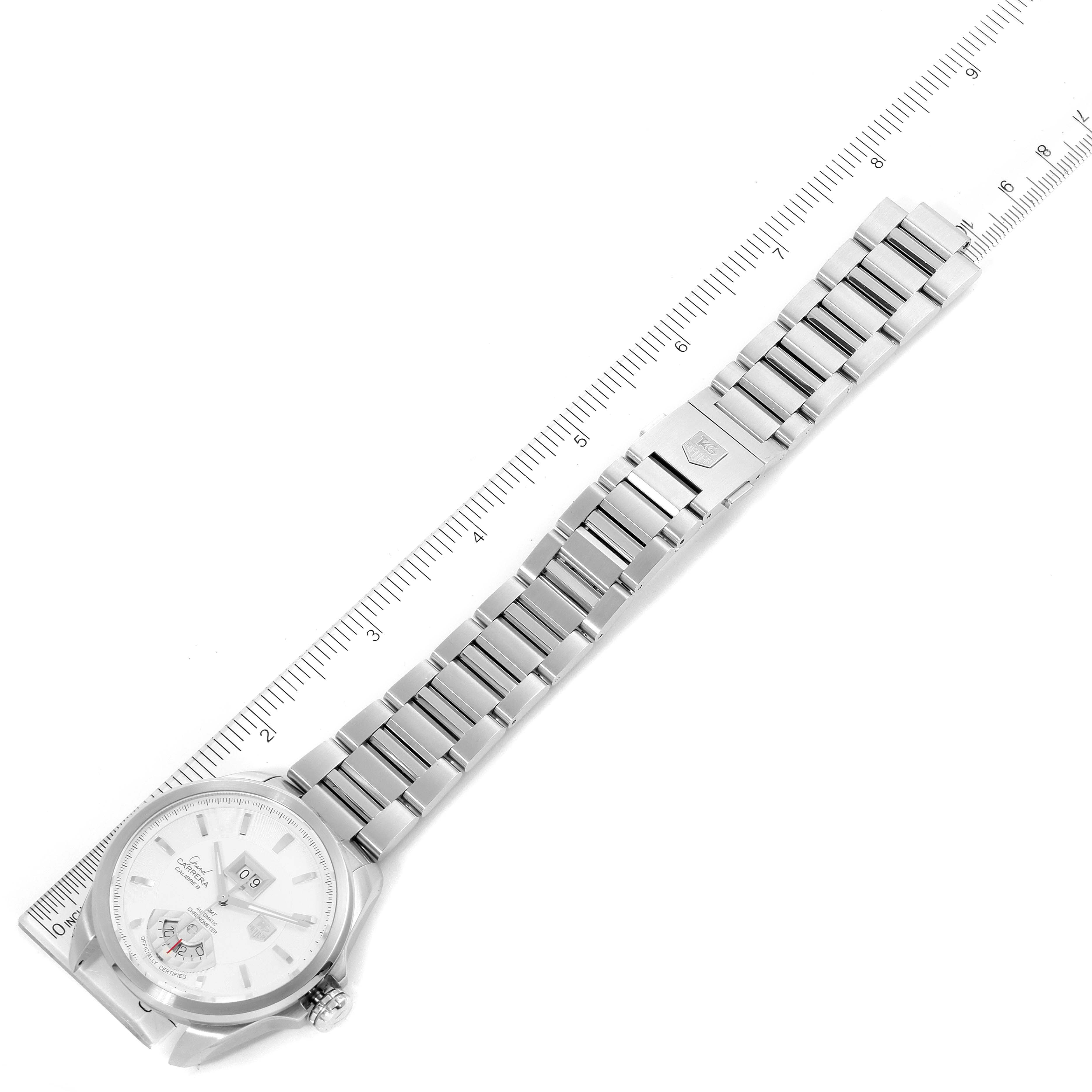 The Tag Heuer Carrera WAV5112.BA0901 Men's Stainless Steel Silver Dial WAV5112.BA0901 Men's Stainless Steel Silver Dial watch is shown at a top-down angle, displaying the entire face and metal strap alongside a ruler.