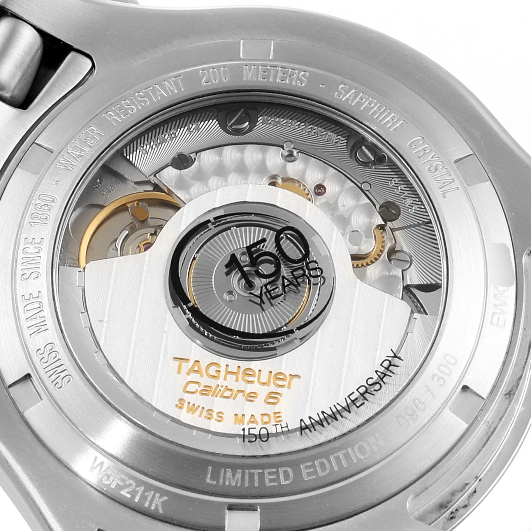 The image shows the back of a Tag Heuer Link WJF211K.BA0570 Men's Stainless Steel Mother of Pearl Dial WJF211K.BA0570 Men's Stainless Steel Mother of Pearl Dial model watch, highlighting its intricate movement and inscriptions.